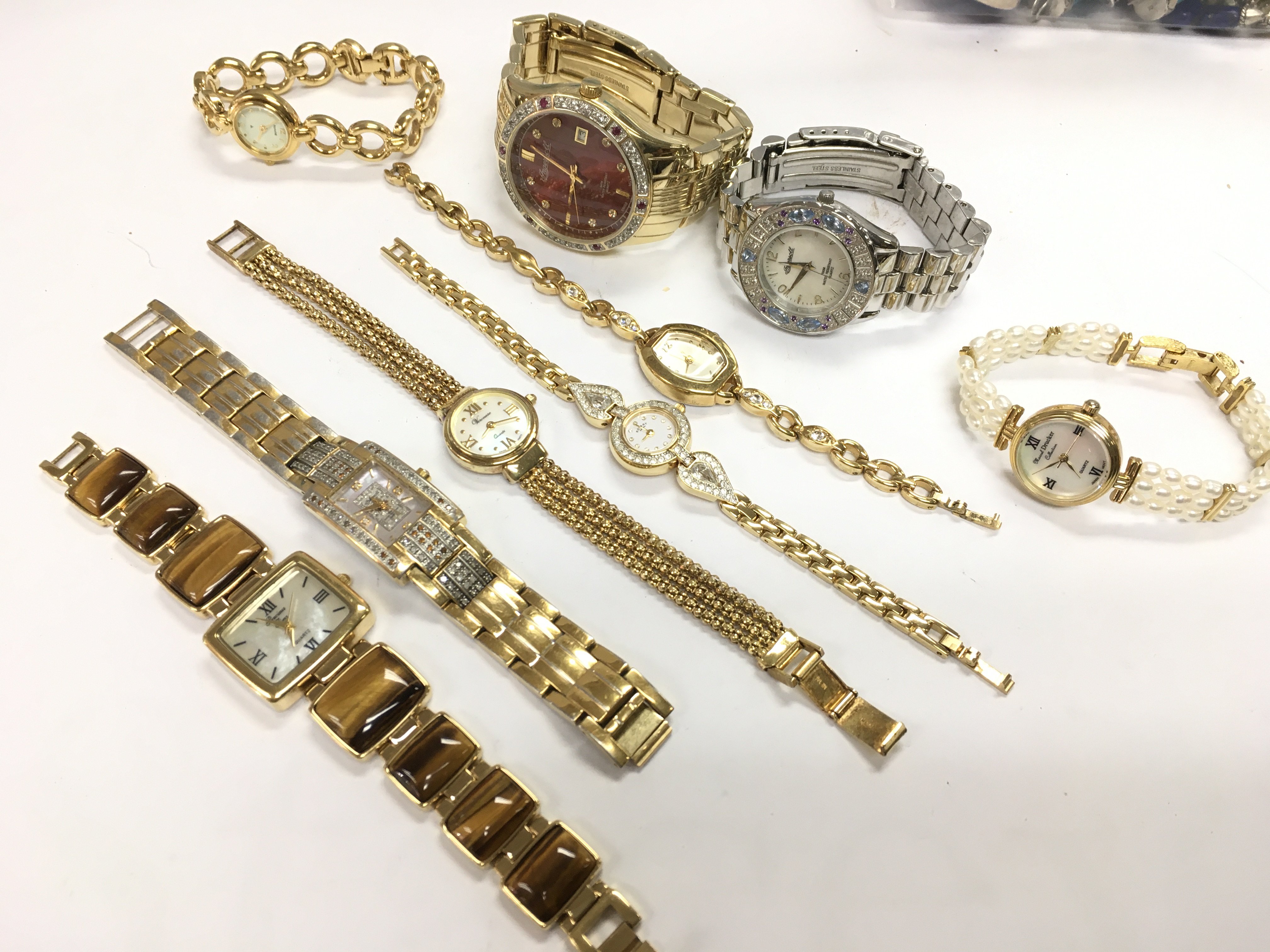 A collection of fashion watches including Ingersoll, Accurist, Rotary etc . Postage catA