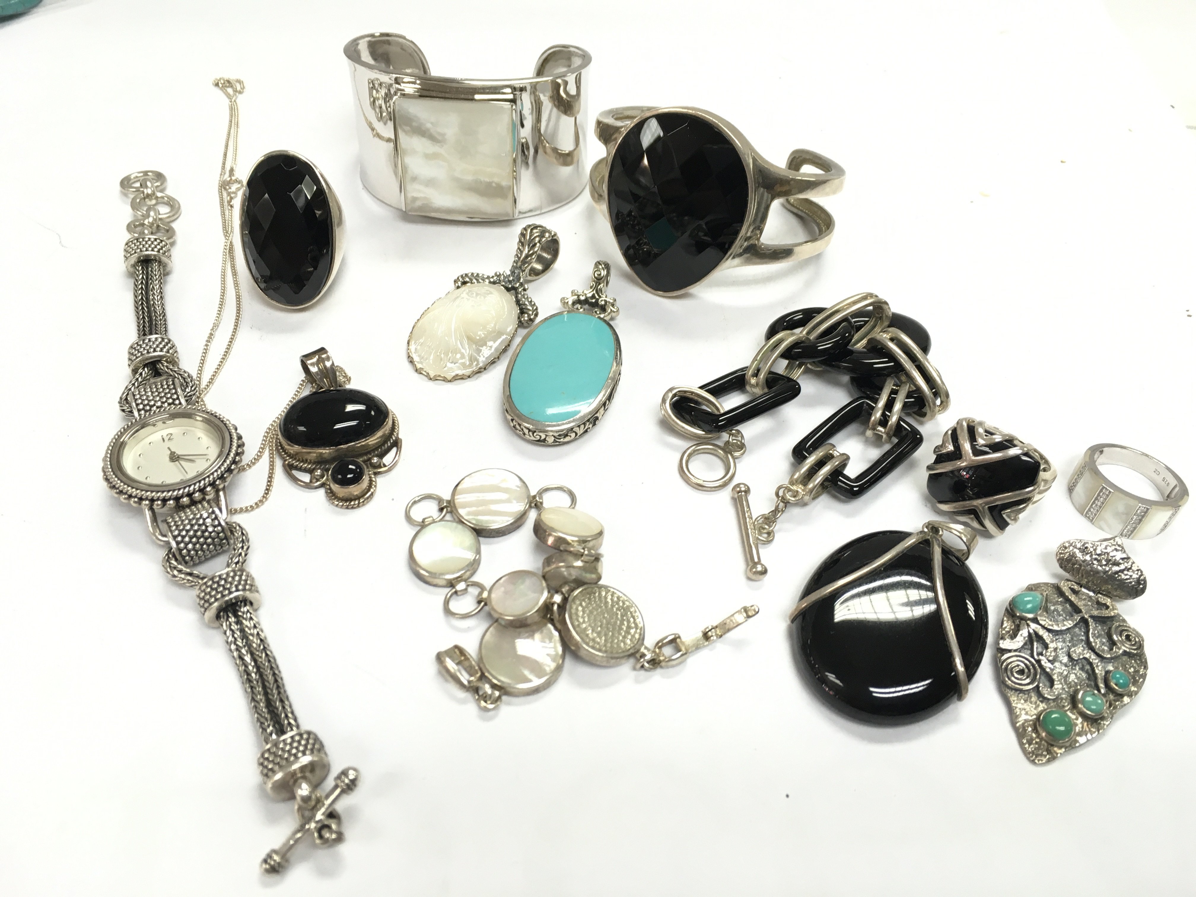 A mixed collection of sterling silver and onyx jewellery. Postage category A