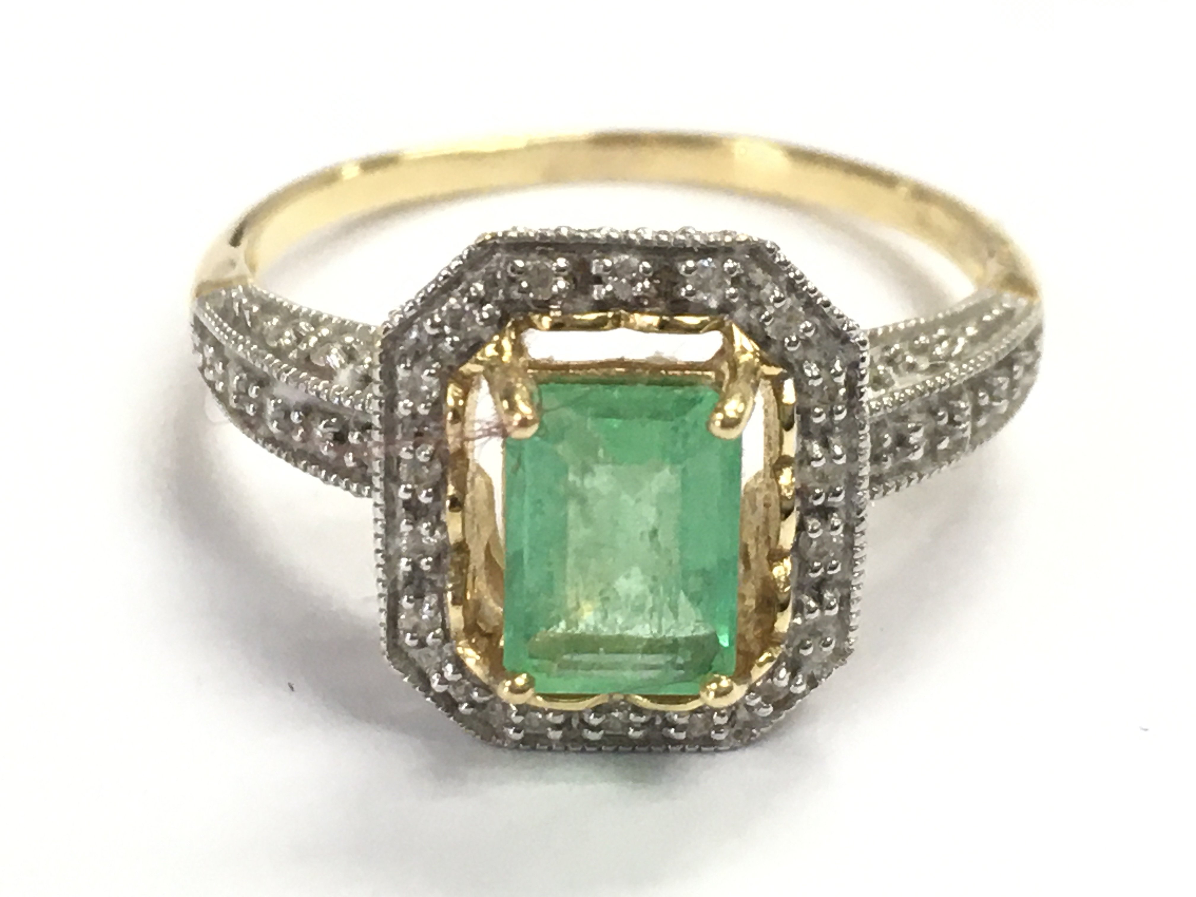 A 9 carat gold emerald and diamond shard ring , size P/Q. 4.4g total weight. Postage category A
