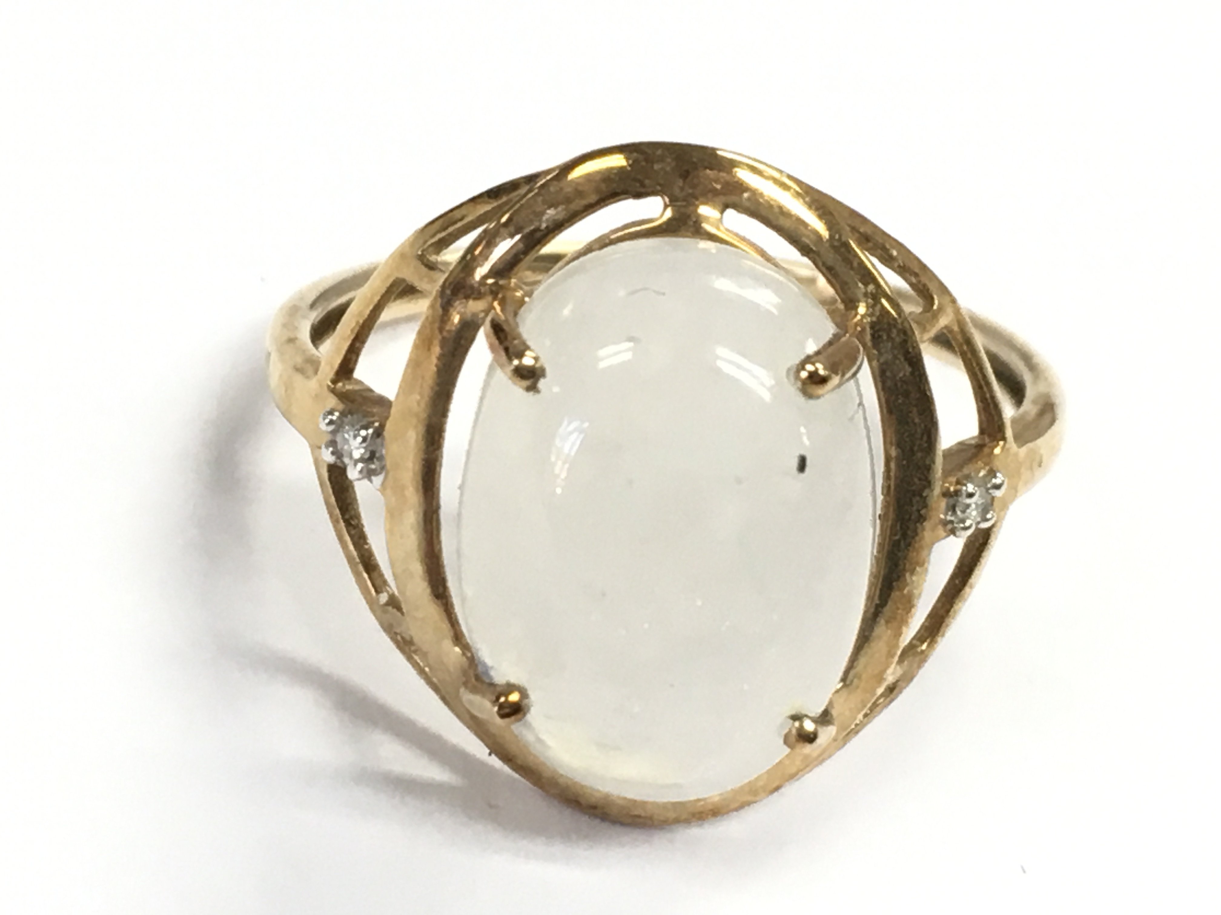 A 9 carat gold moonstone ring , R/S. 3g postage category A