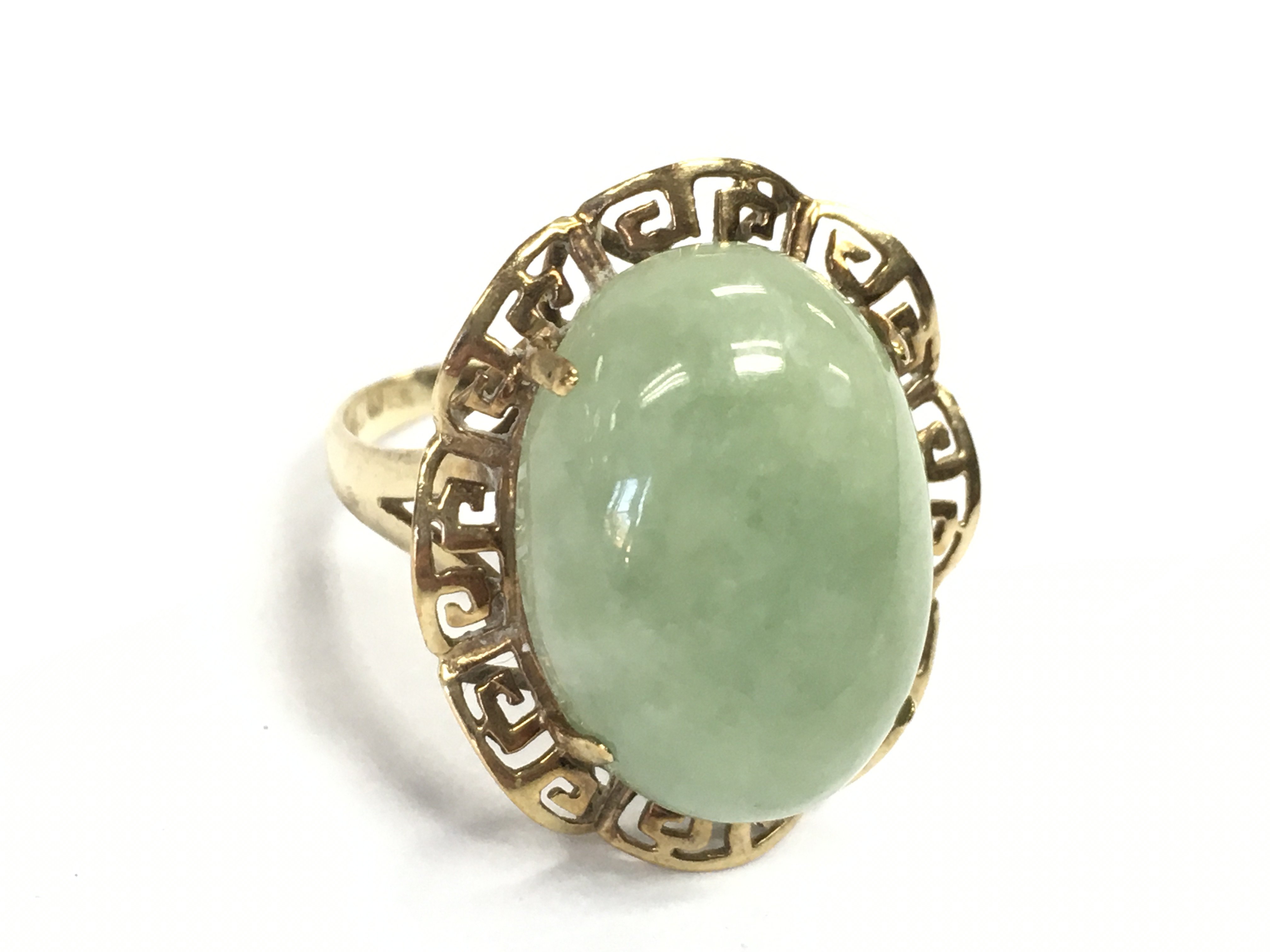 A 9 carat gold jade stone ring , size O. 5g Postage category A