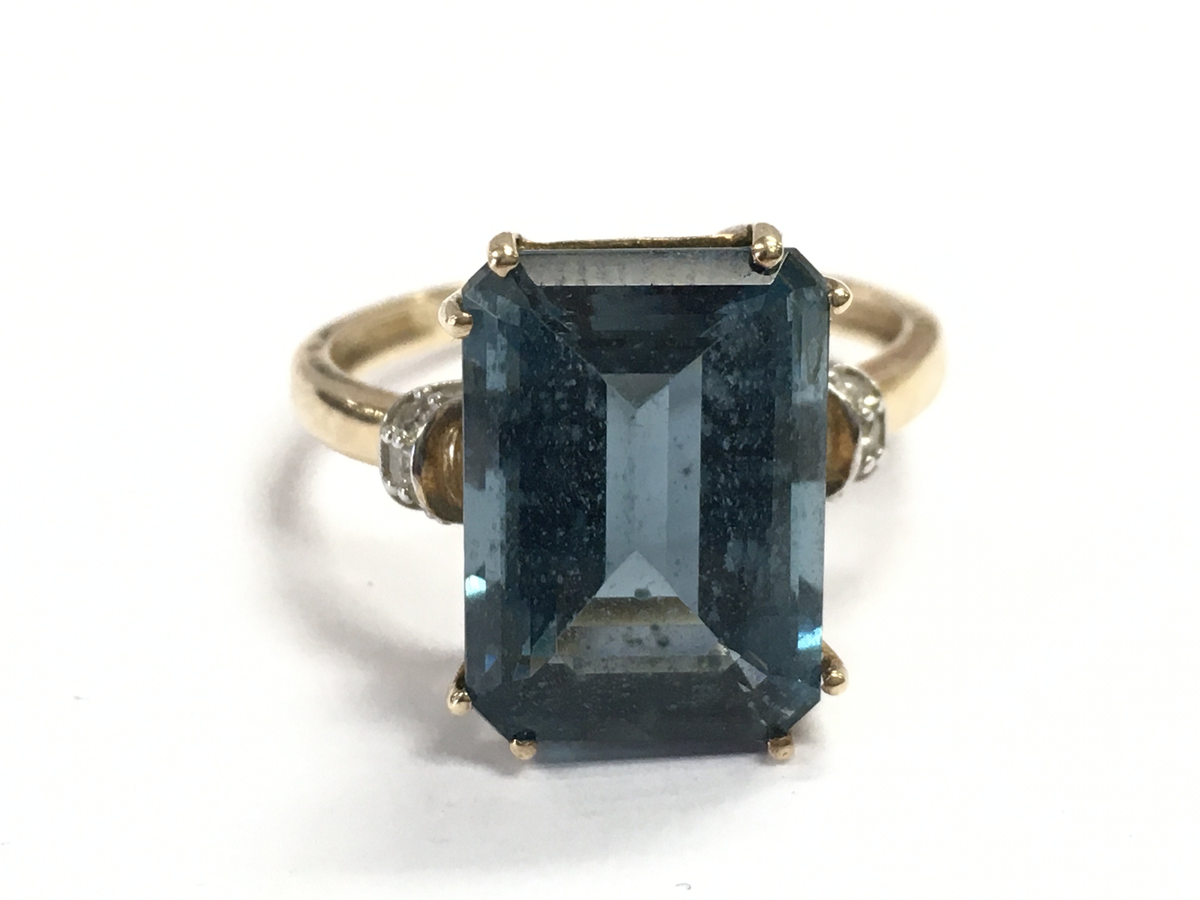 A 9 carat gold blue topaz cocktail ring , size R. 4.3g total weight. Postage category A