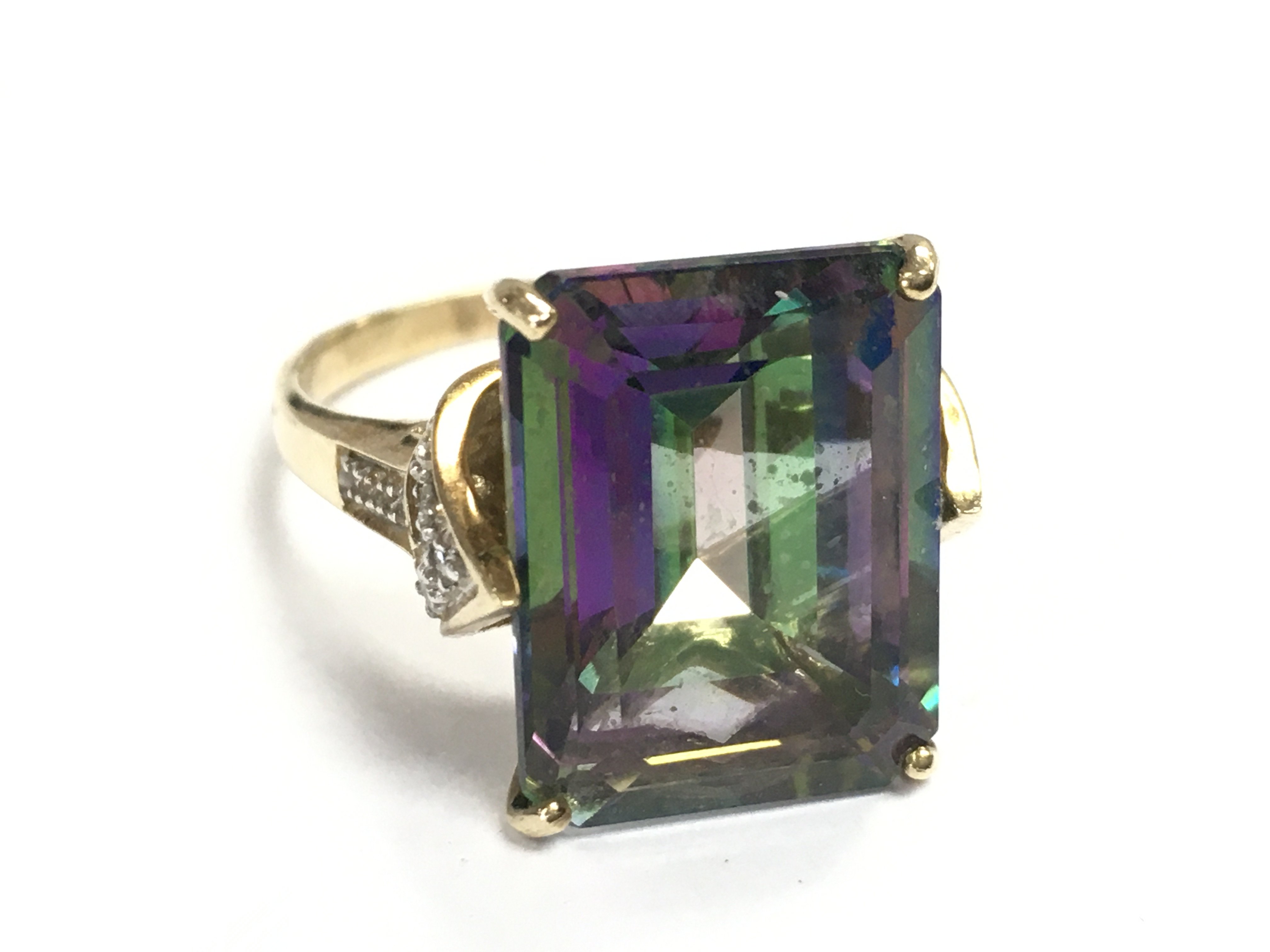 A 9 carat gold emerald and topaz ring , size P, 6g total weight. Postage category A