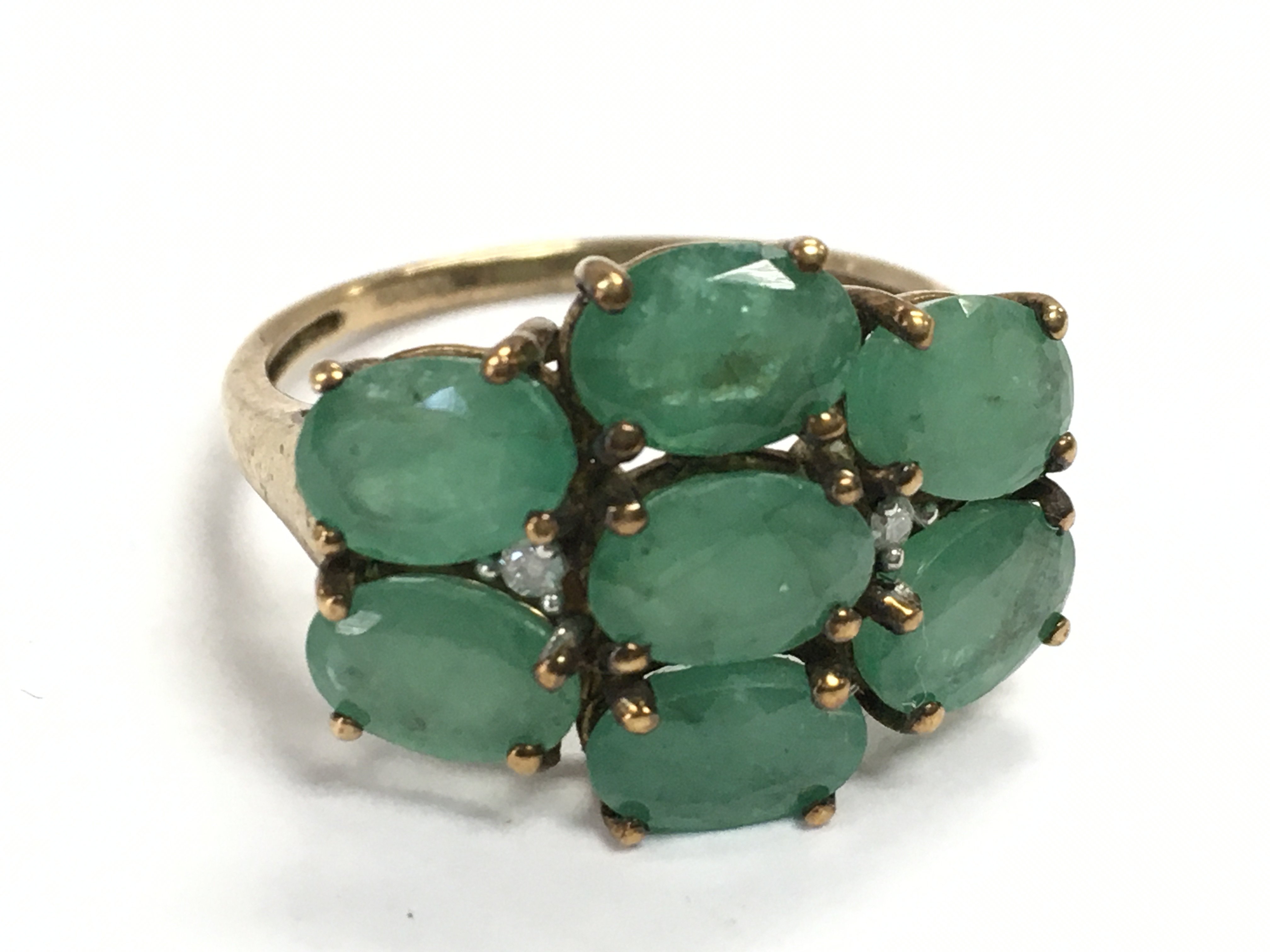 A 9 carat gold emerald cocktail ring , size R/S. 3.6g postage category A