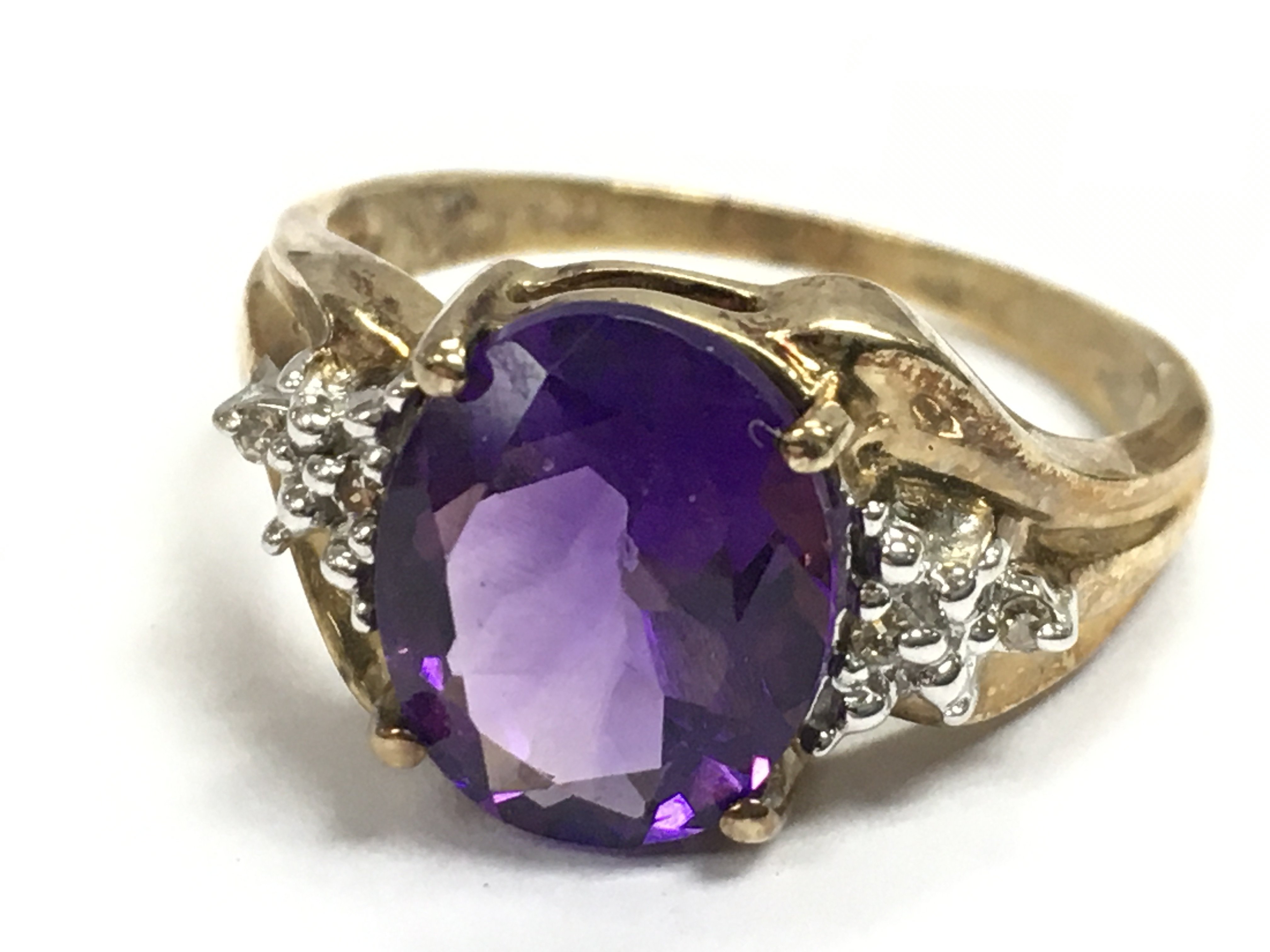 A 9 carat gold amethyst ring , 3.5g total weight. Size Q. Postage category A