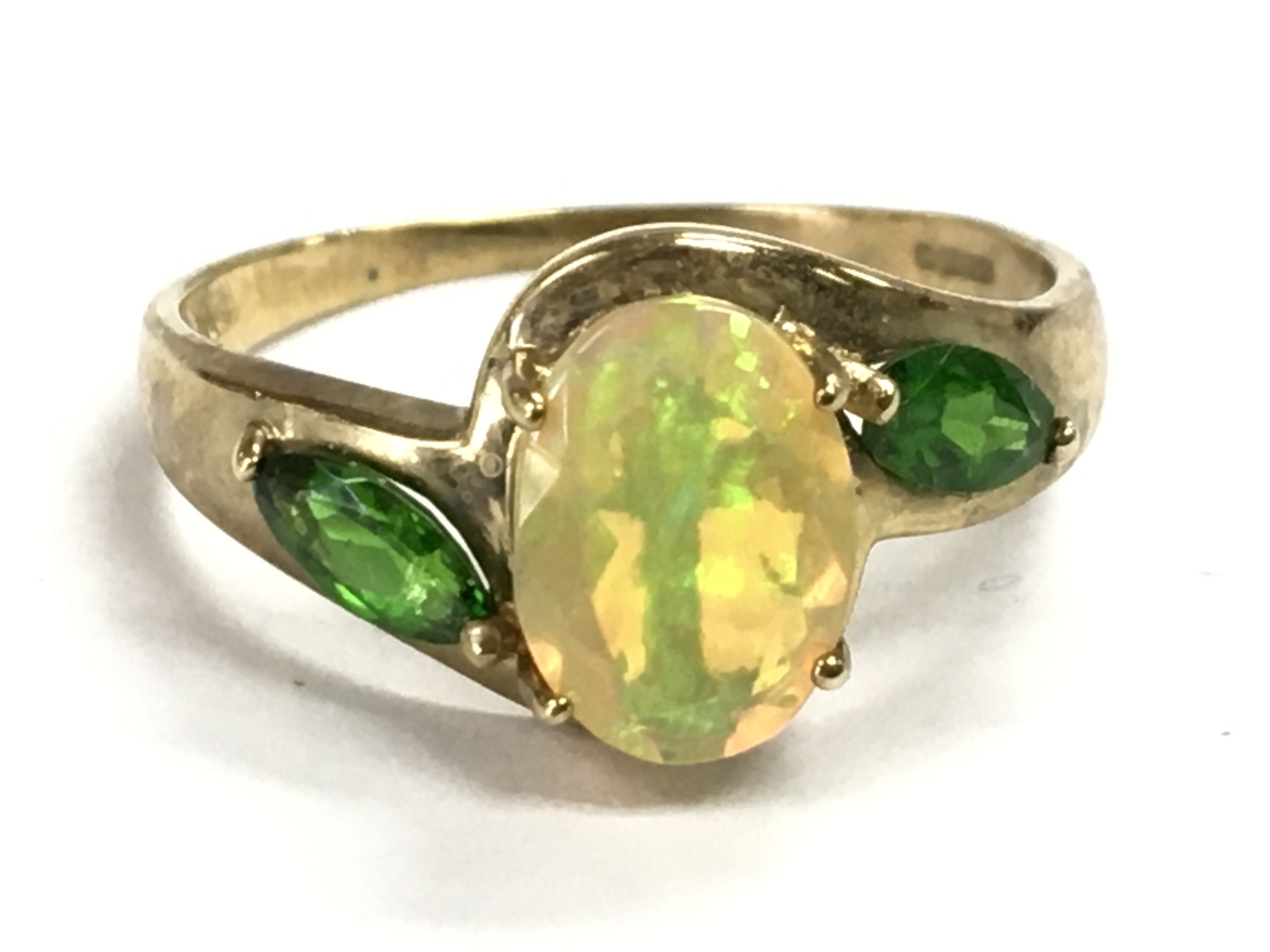 A 9 carat gold Australian Black Opal and emerald ring , size Q. 2.5g total weight Postage category A