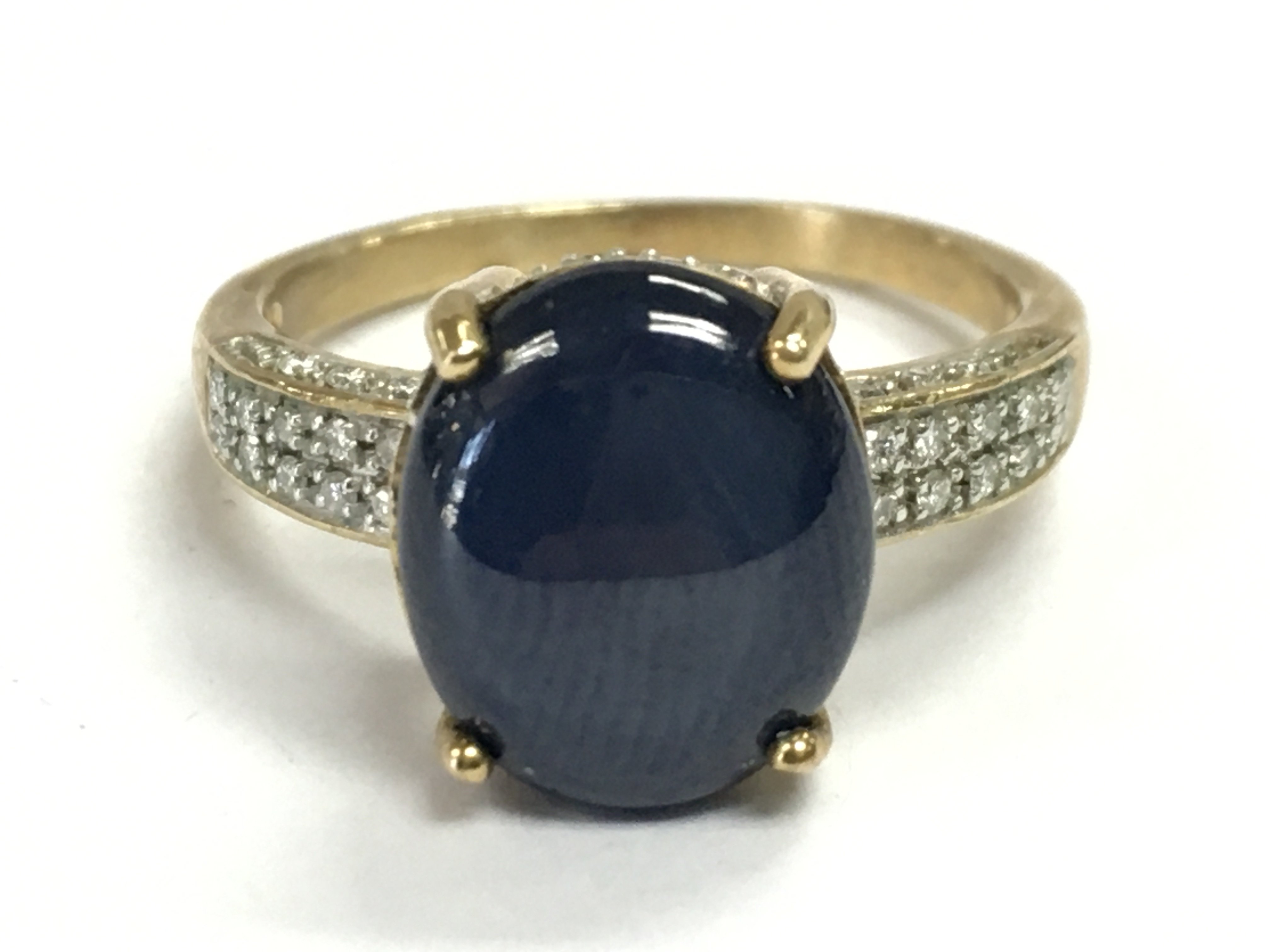 A 9 carat gold Cabochon ring set with diamond shards , size P. 4.2g total weight Postage category A