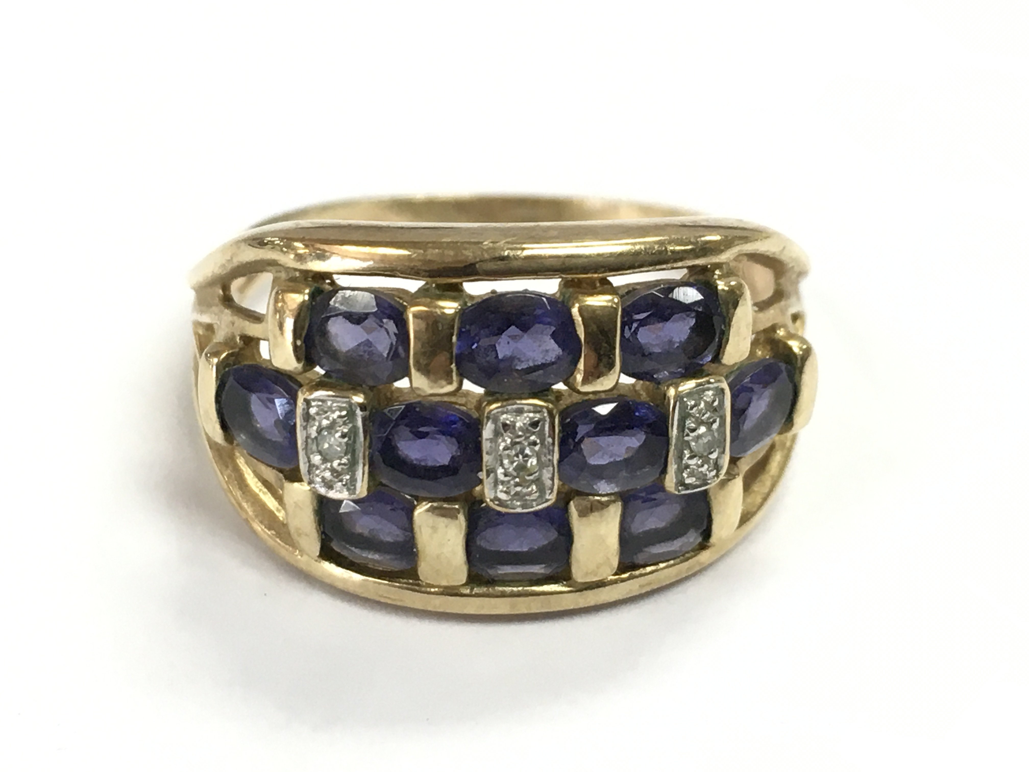 A 9 carat gold diamond and sapphire ring Q/R. 3.9g Postage category A