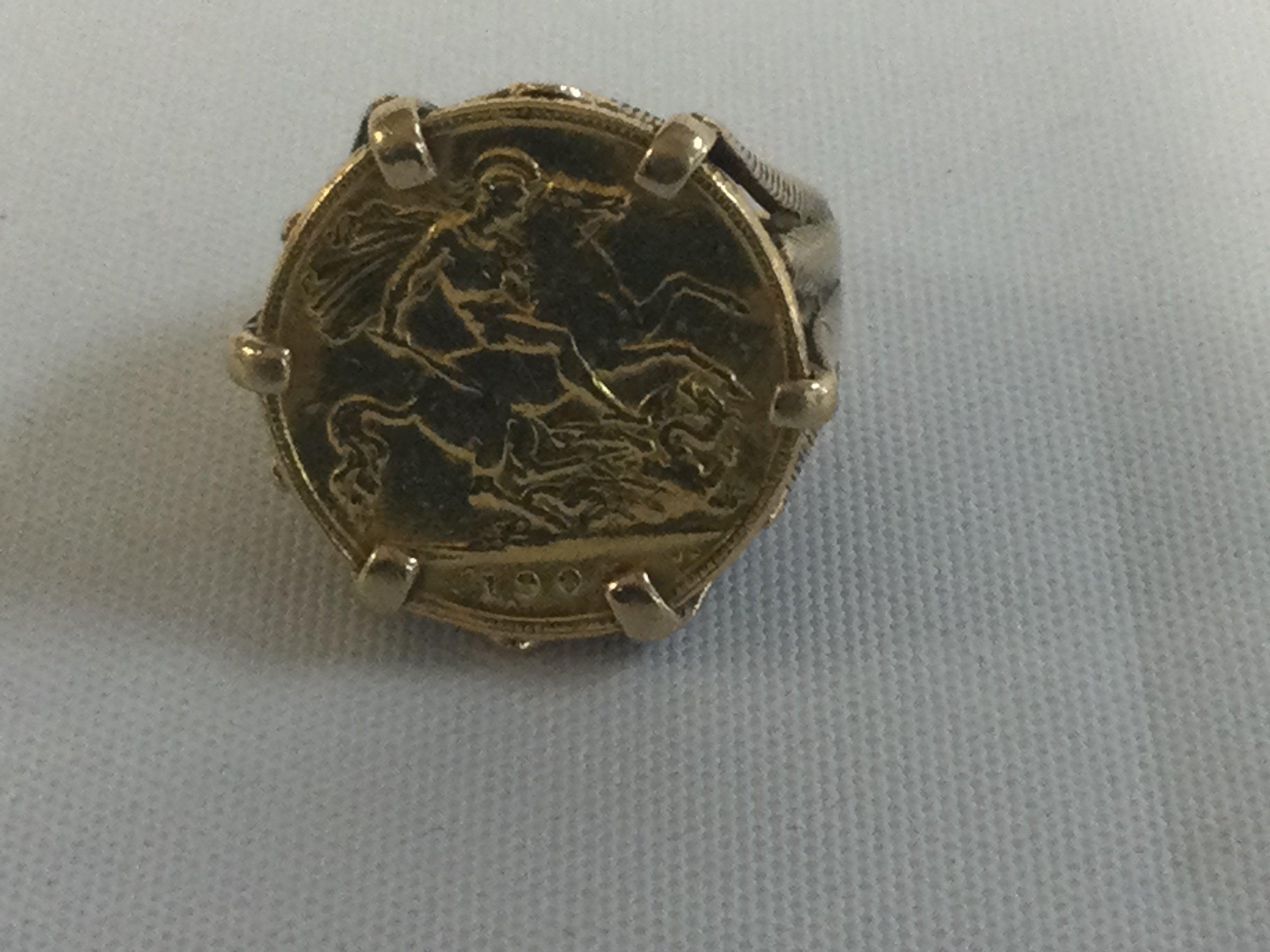 A half sovereign fitted in a gold ring 10.3 grams.