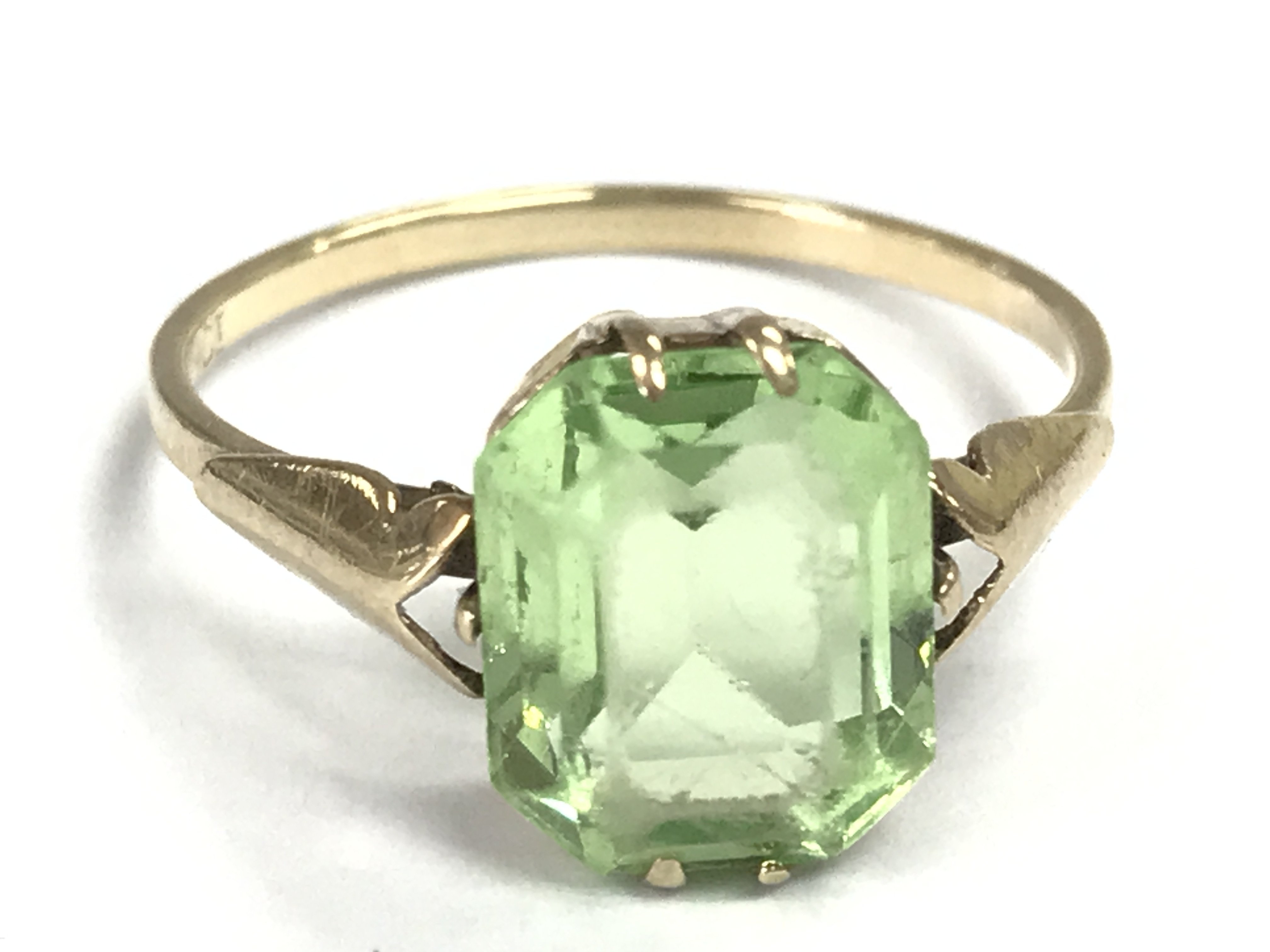 Green baguette stone 9ct gold ring . Size N. 1.7g Postage category A