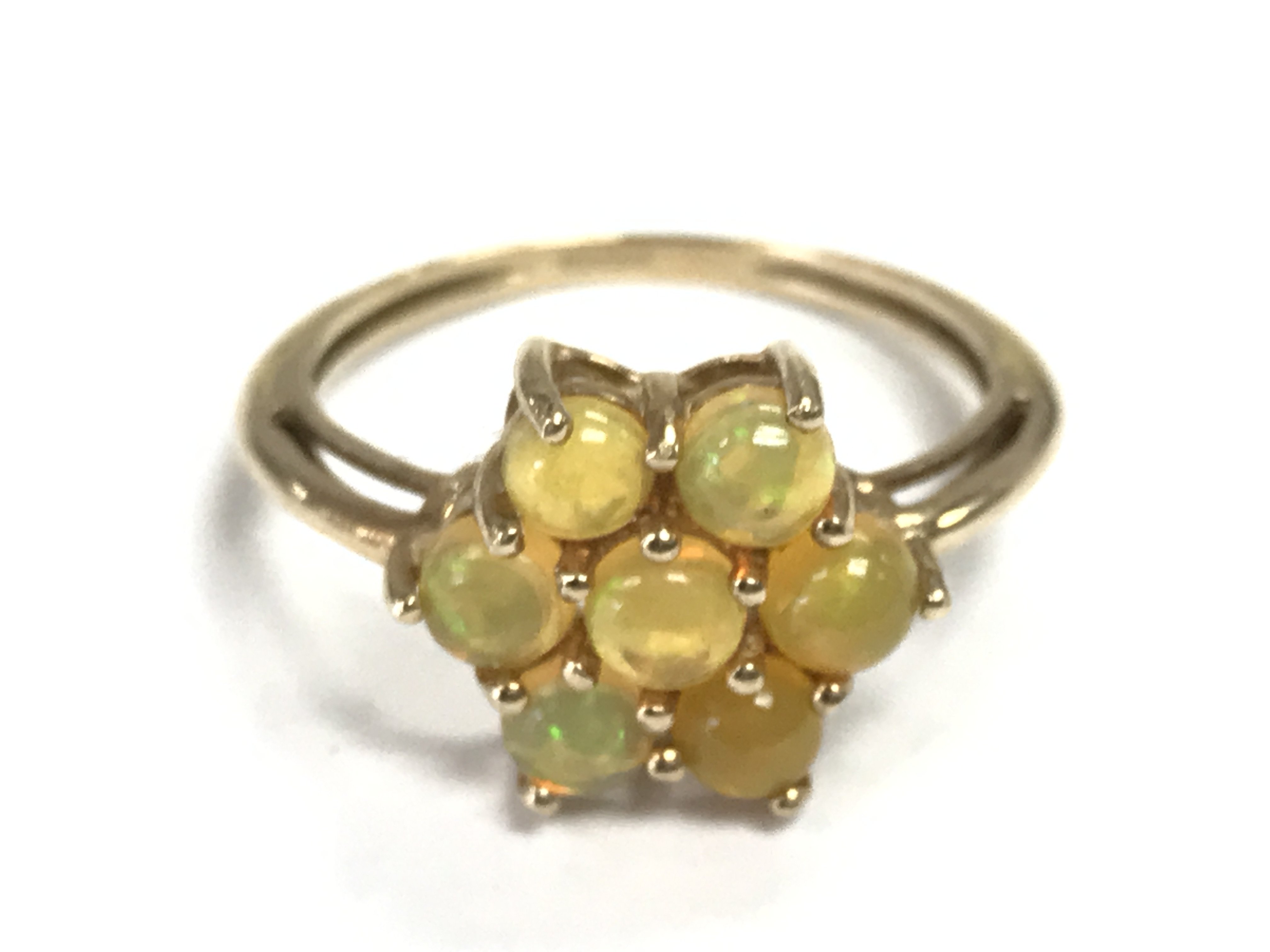 A 9 carat Opal cluster ring .2.3g total weight. Size R Postage category A