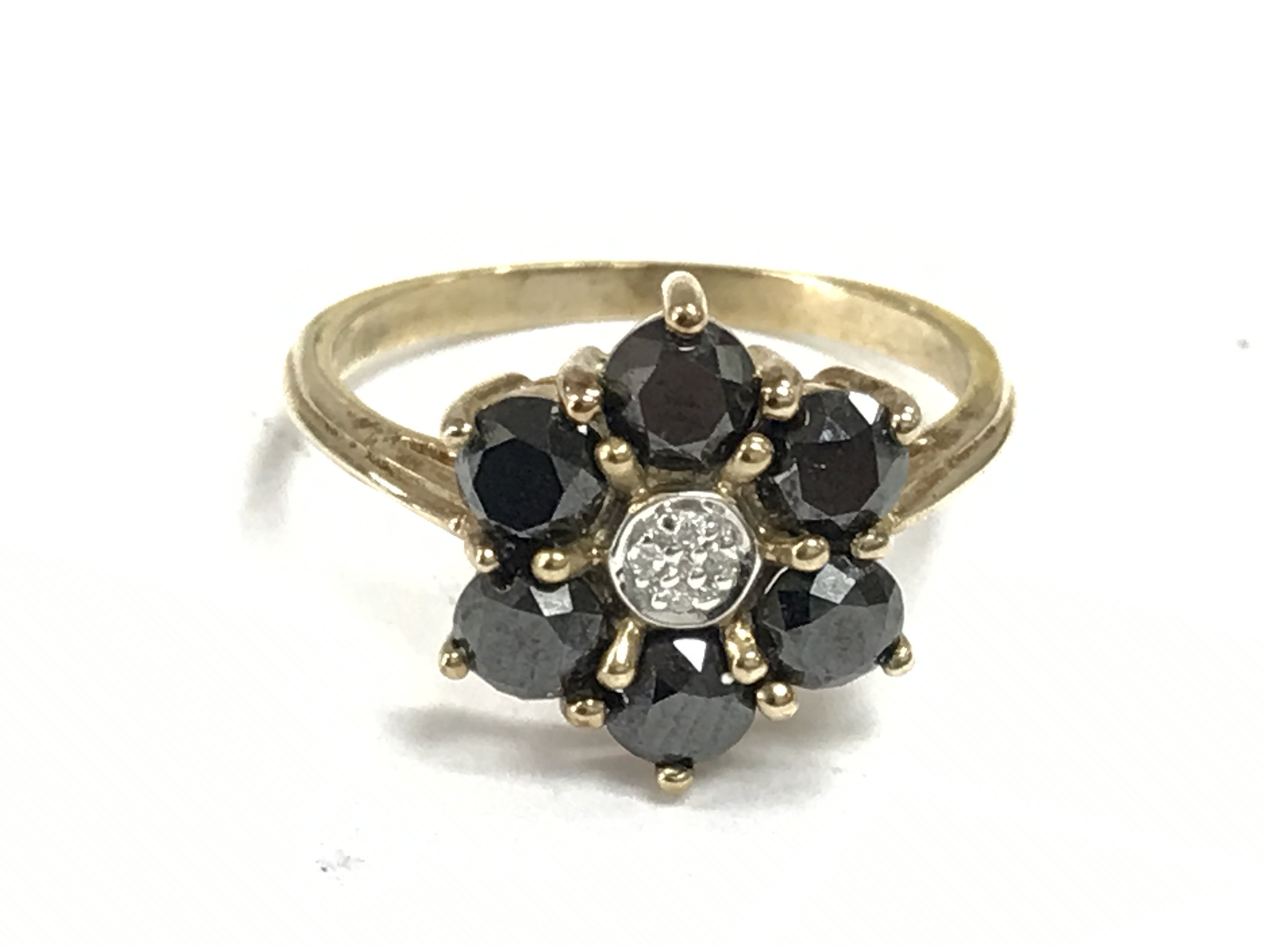 A 9 carat gold sapphire and diamond ring size P/Q. 3.1g Postage category A