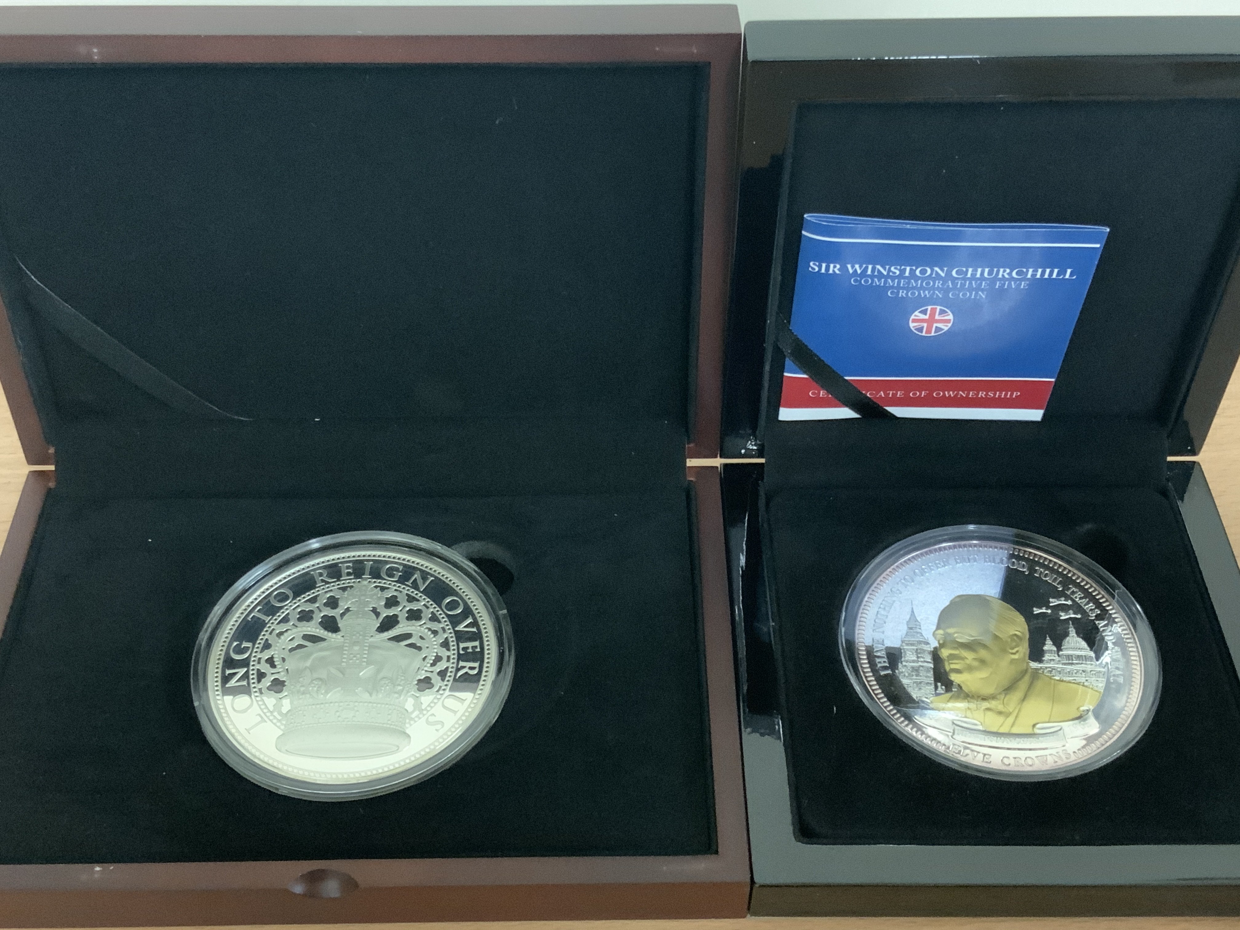 A cased sterling silver 2022 proof 5OZ coin together with a Churchill 5 Crown coin. (B)