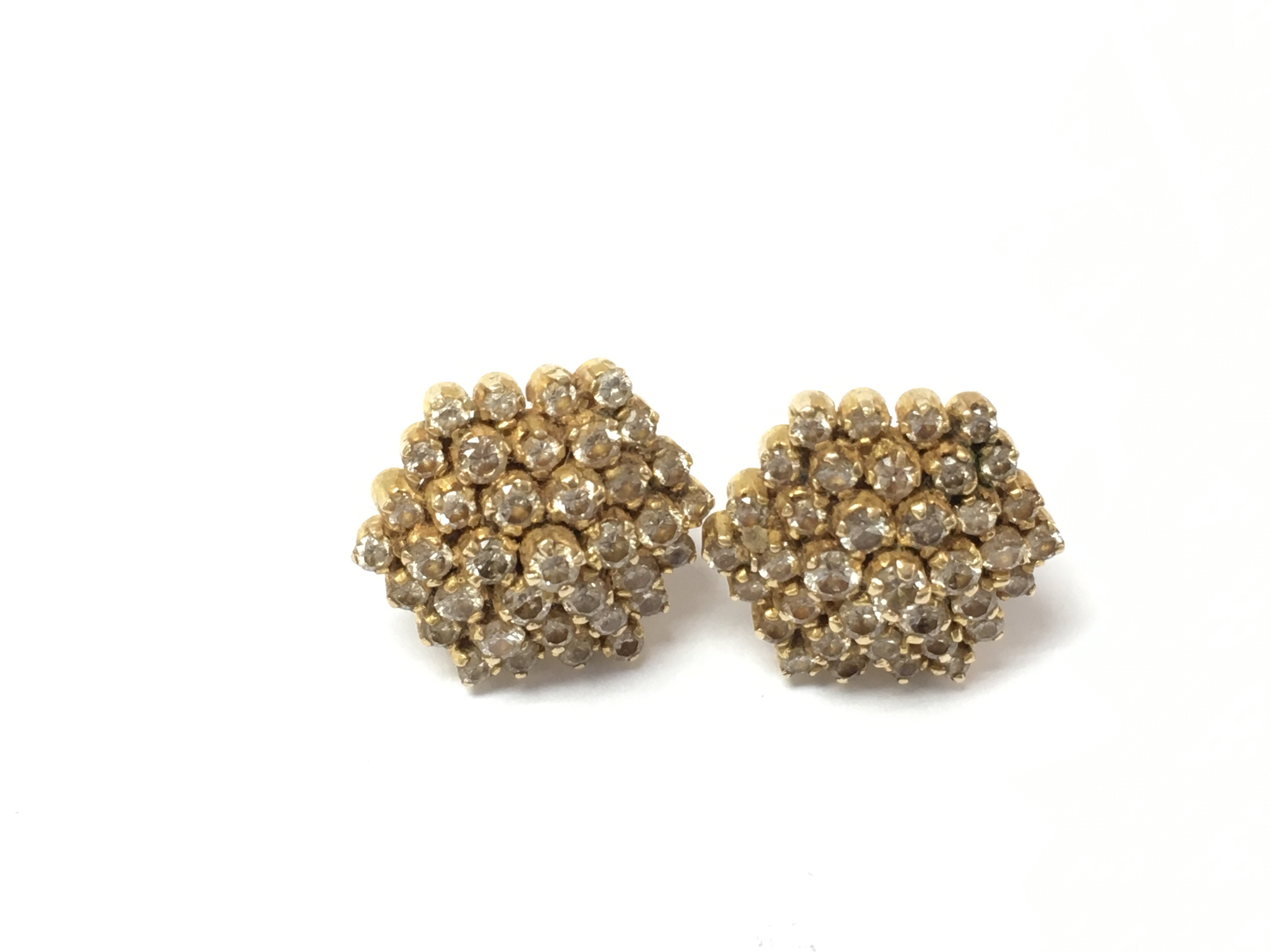 A pair of yellow metal diamond cluster stud earrings. 6.89g