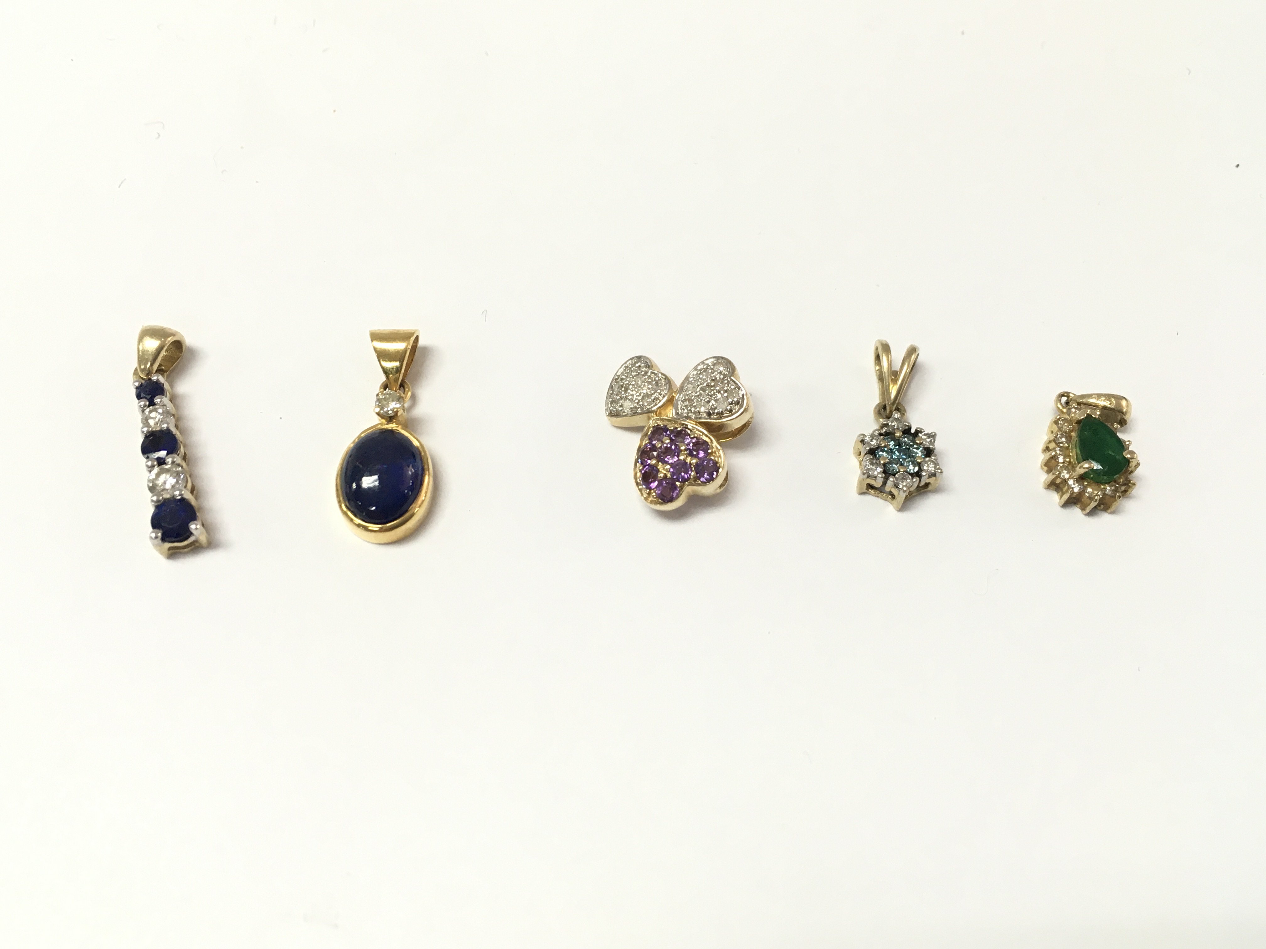 5 14ct gold diamond and mixed stone pendants. 6.63g Postage A
