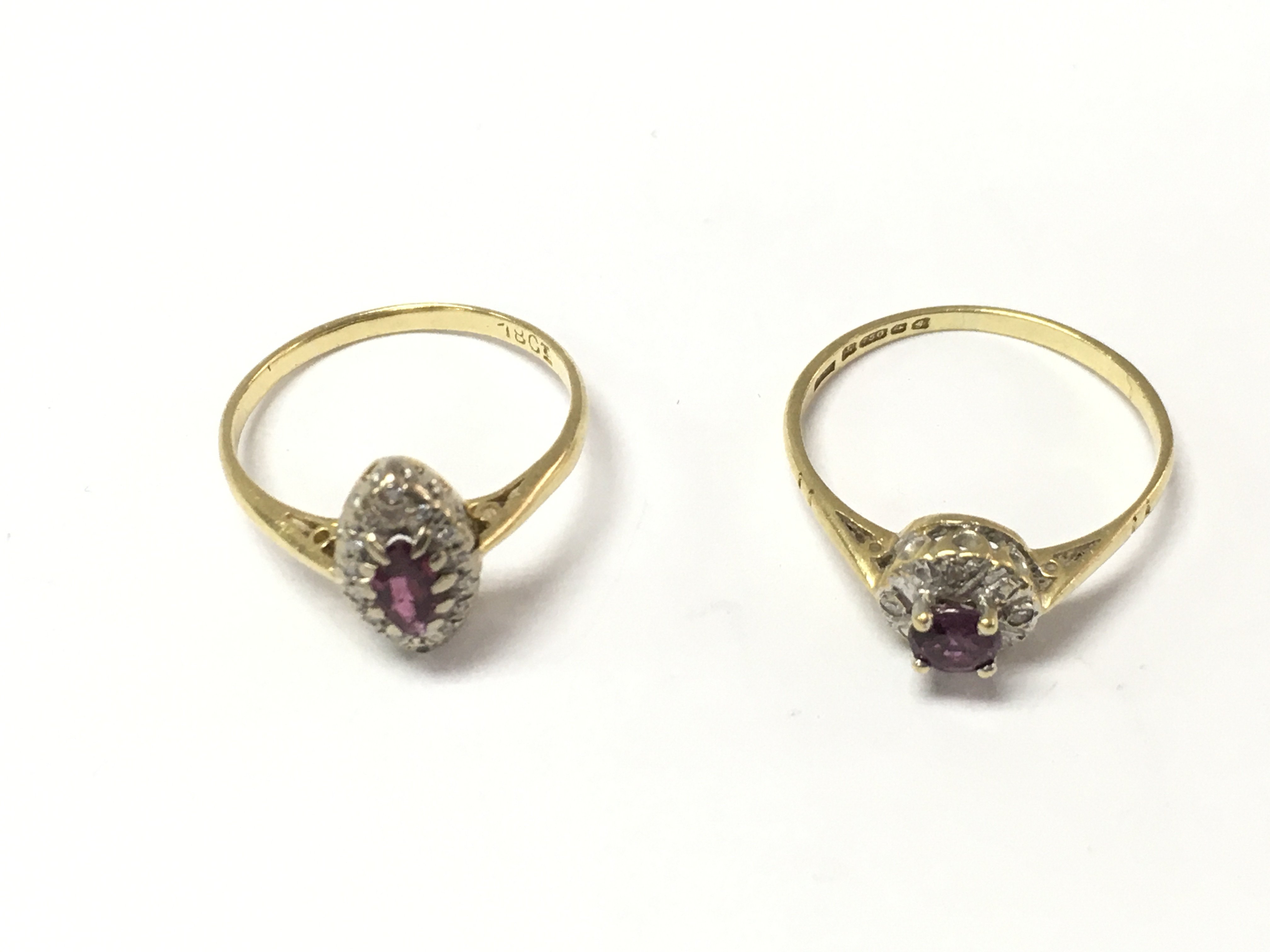 Two 18ct gold diamond and ruby rings. Size L and M 3.86g total.