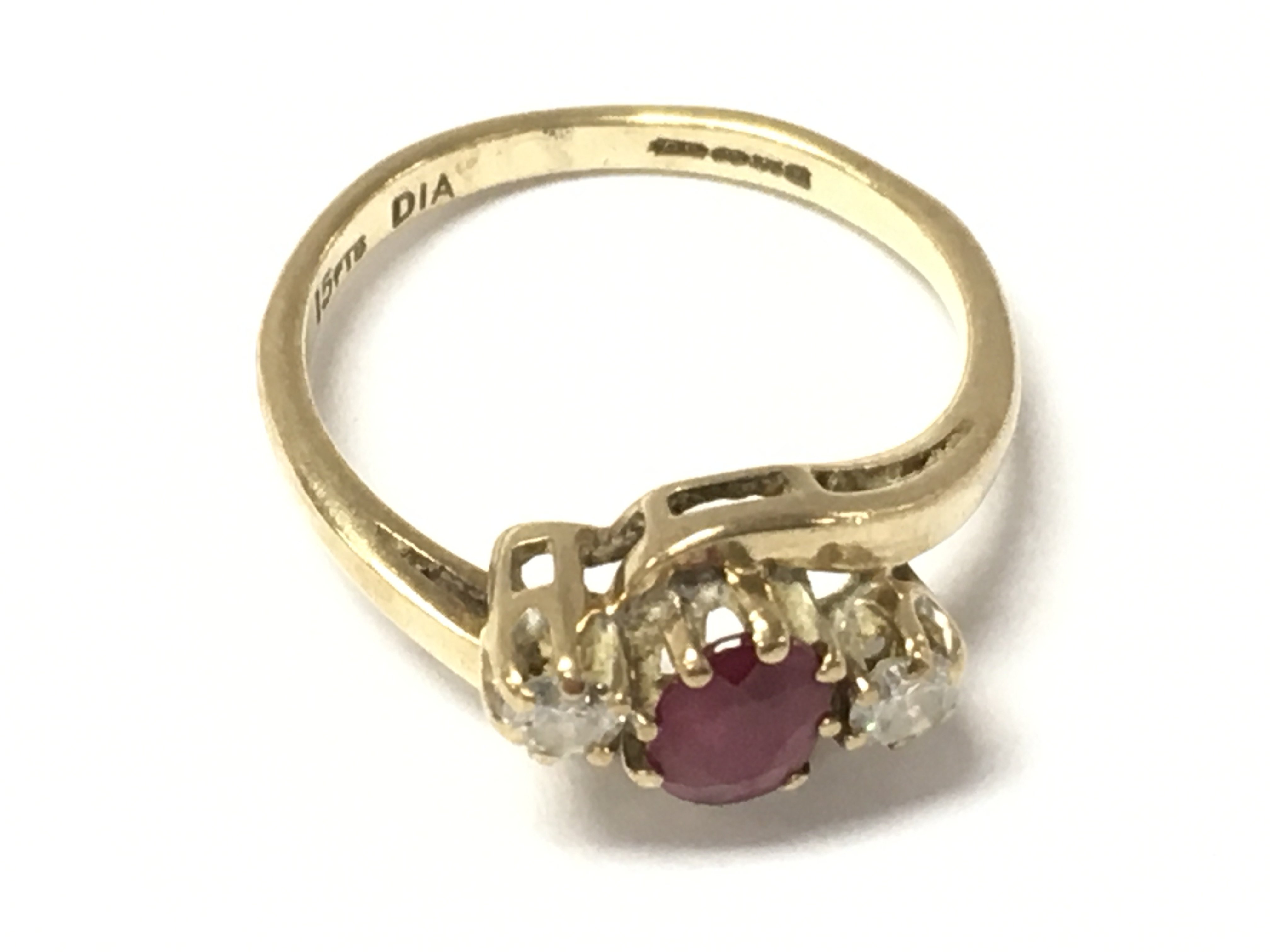 A 9ct gold ruby and diamond ring. Size I and 1.75g