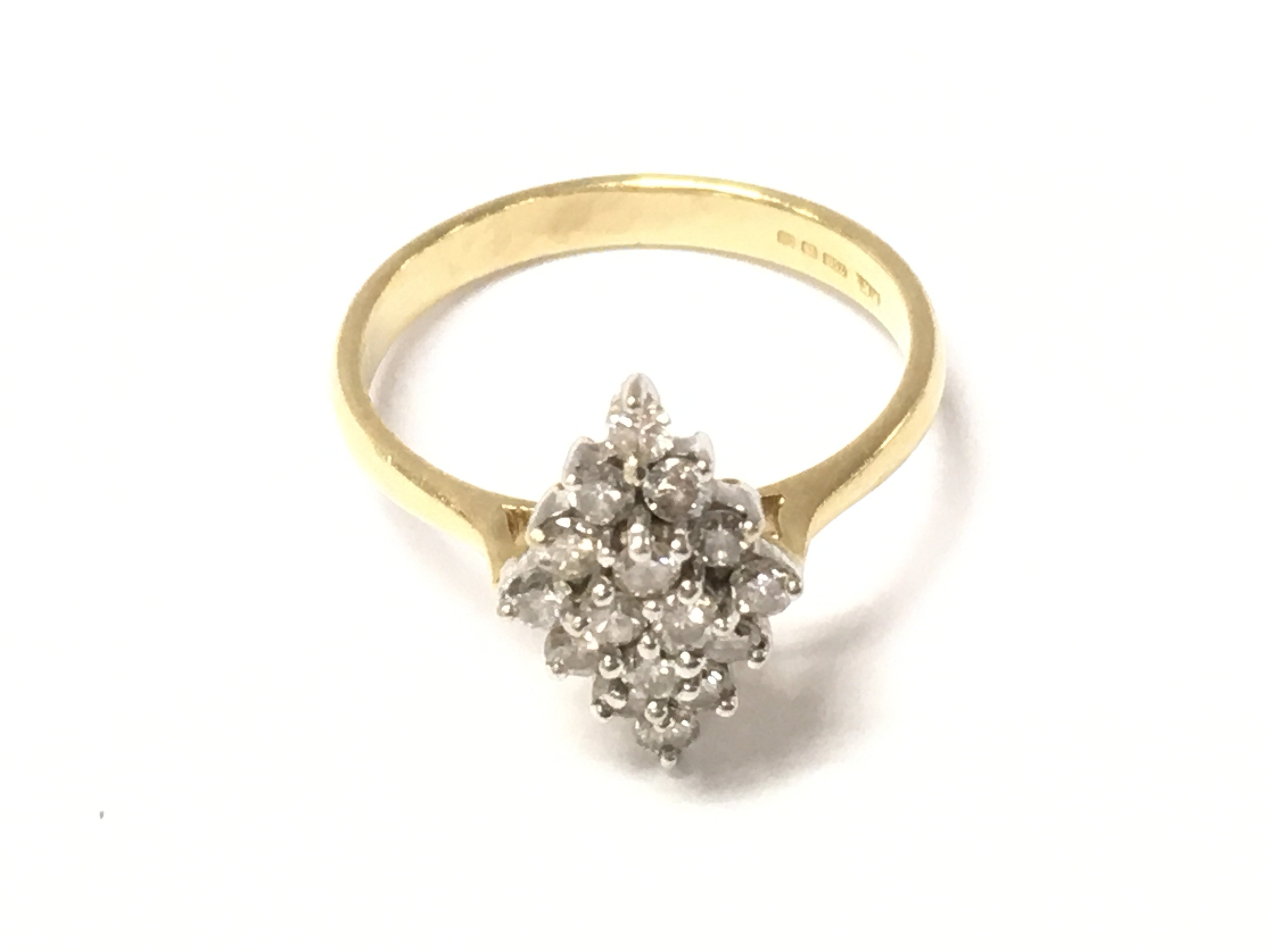 An 18ct gold diamond cluster ring. Size O and 3.74g Postage A