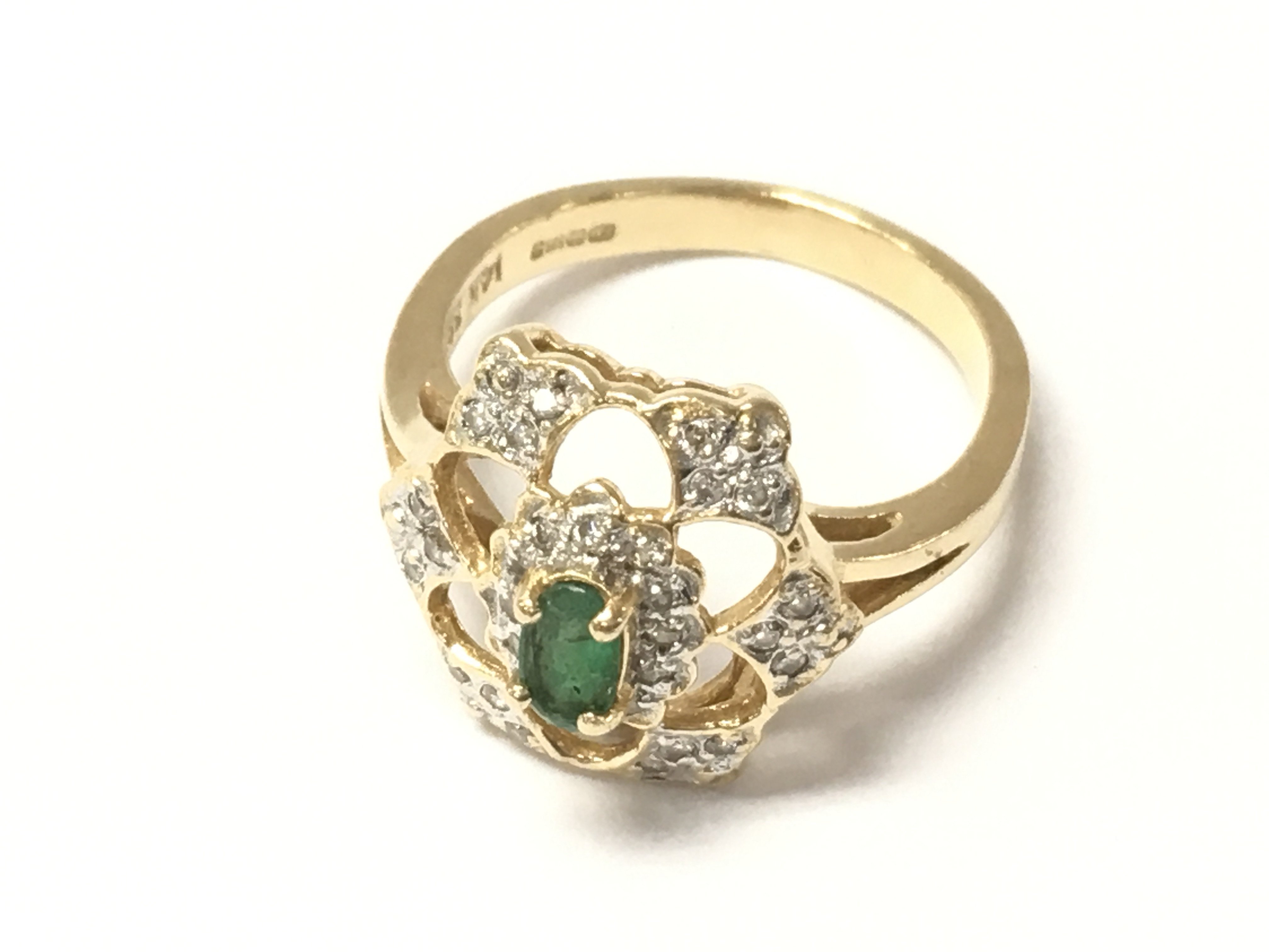 A 14ct gold emerald and diamond set cluster ring. Size L and 3.75g