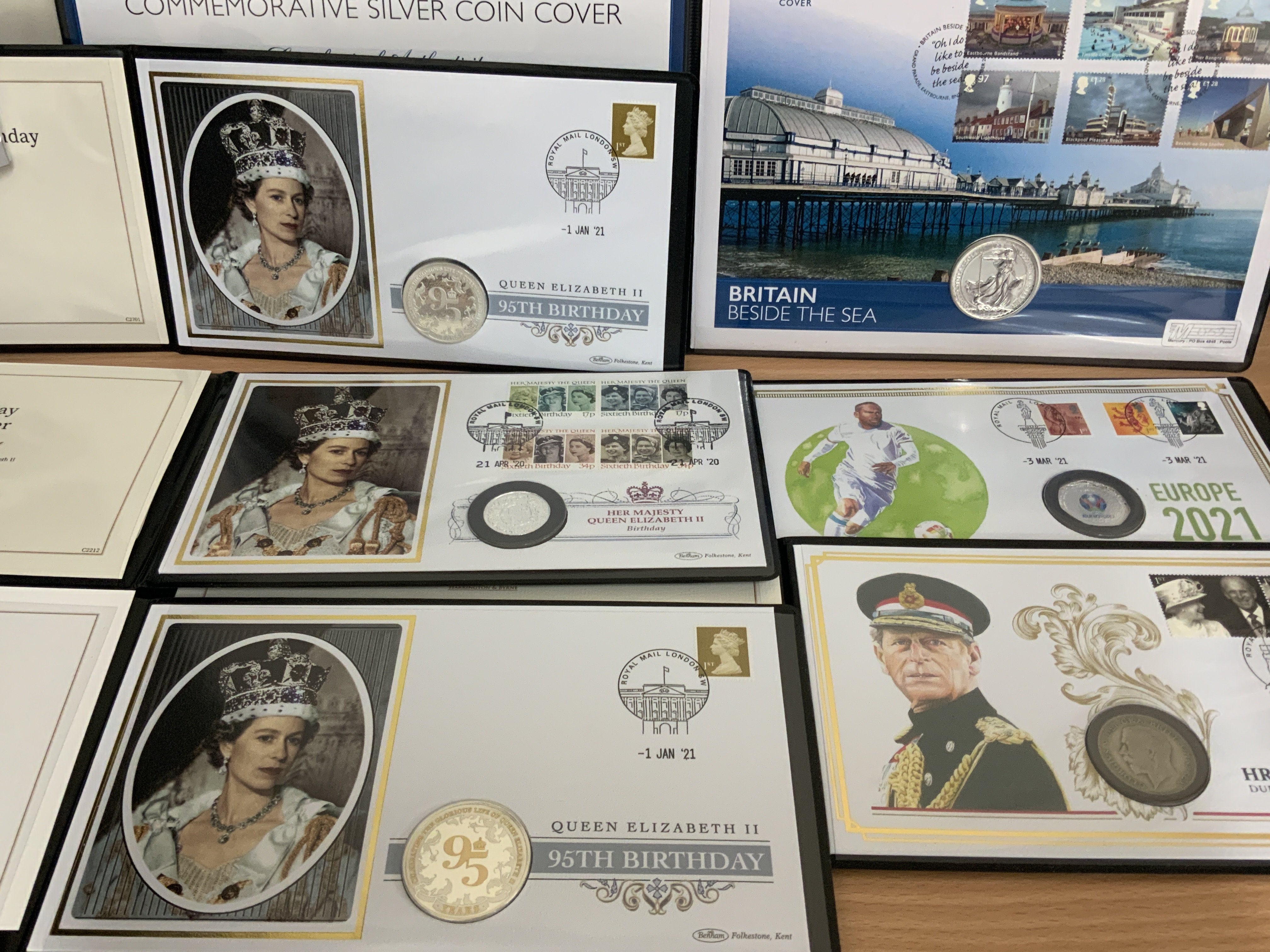 Harrington & Byrne coin and stamp folders. Some include silver coins. (A)