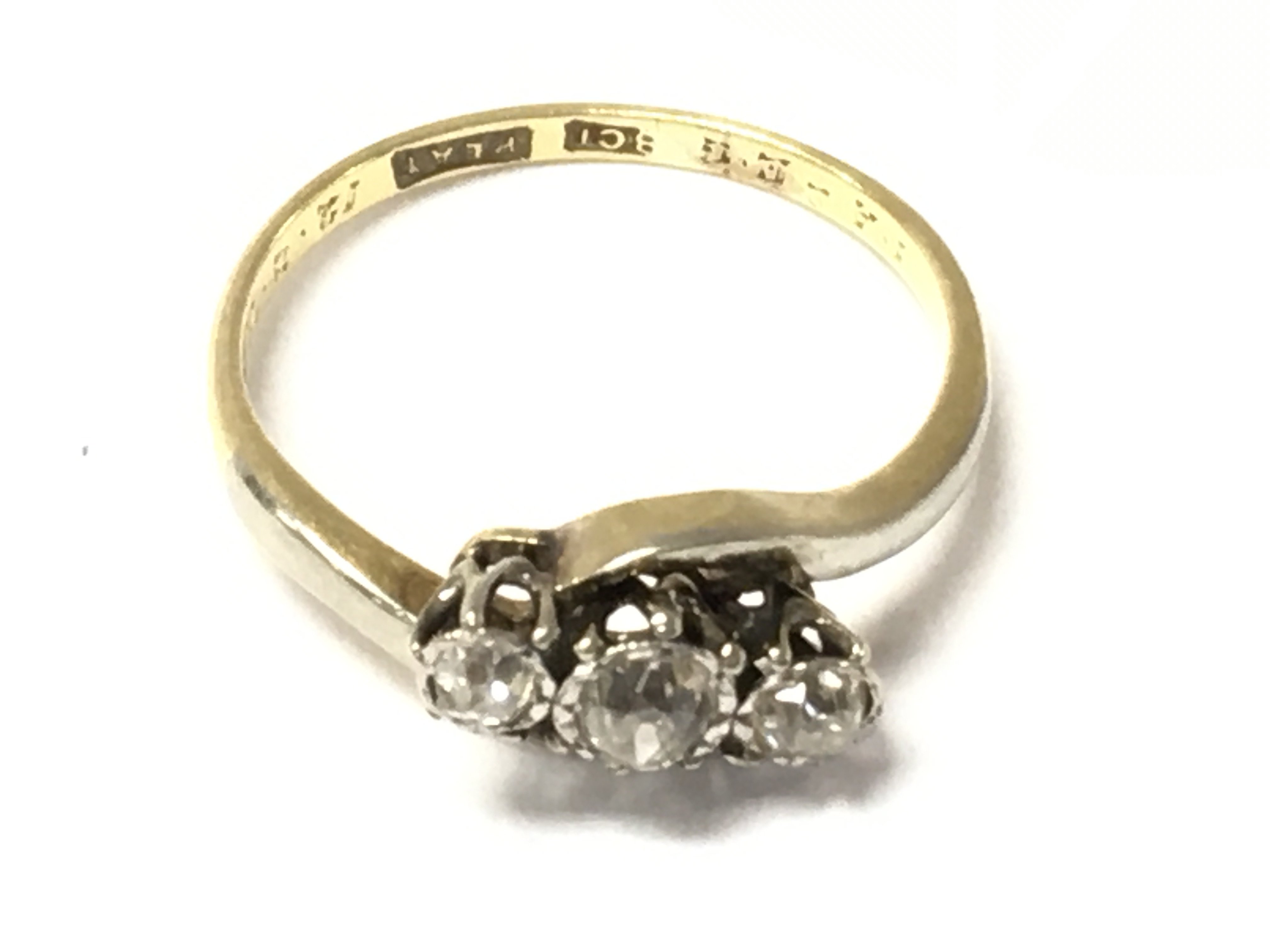 An 18ct gold three old cut diamond ring. Size J and 2.03g