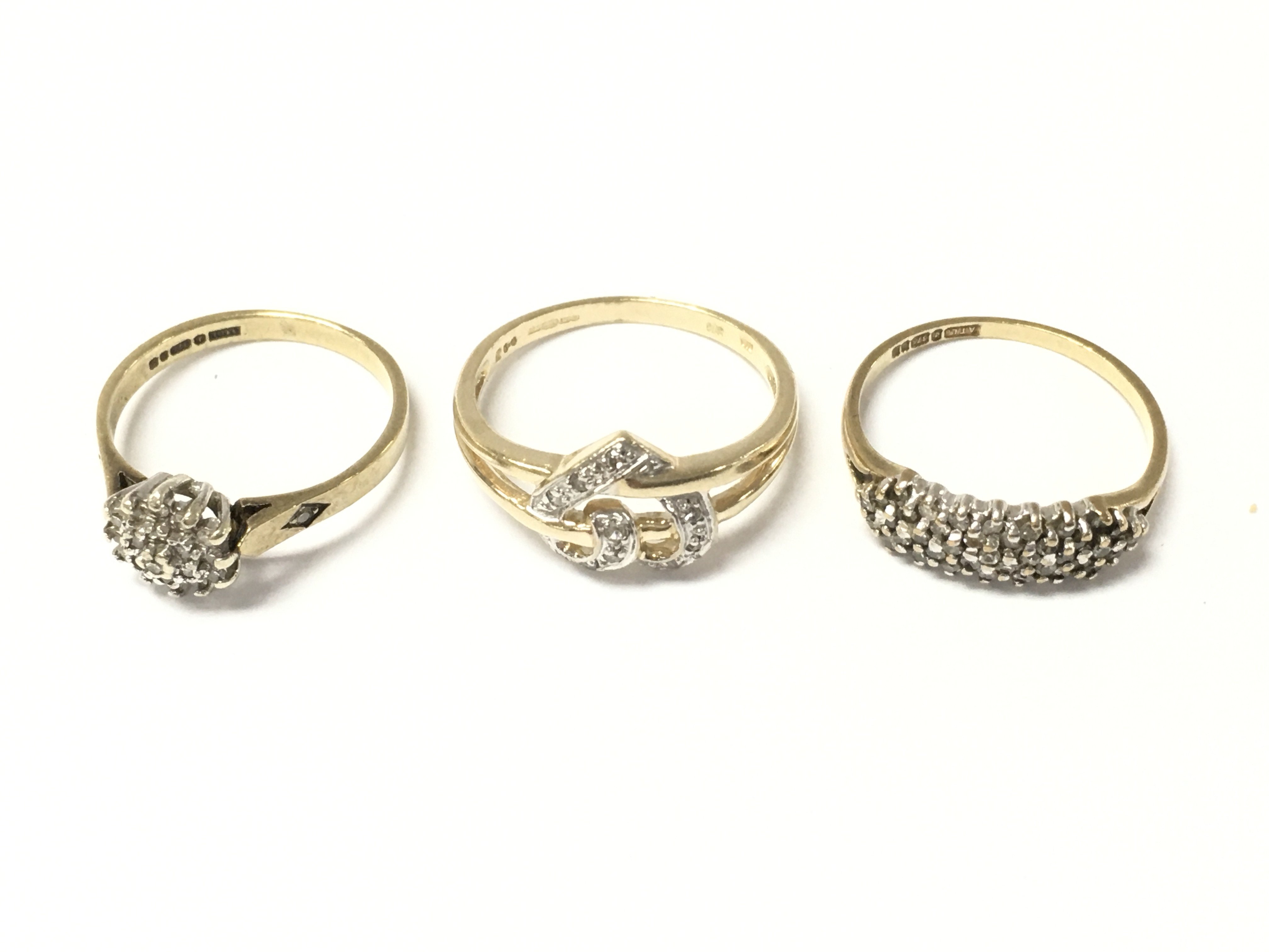 Three 9ct gold diamond cluster rings. 5.1g Postage A