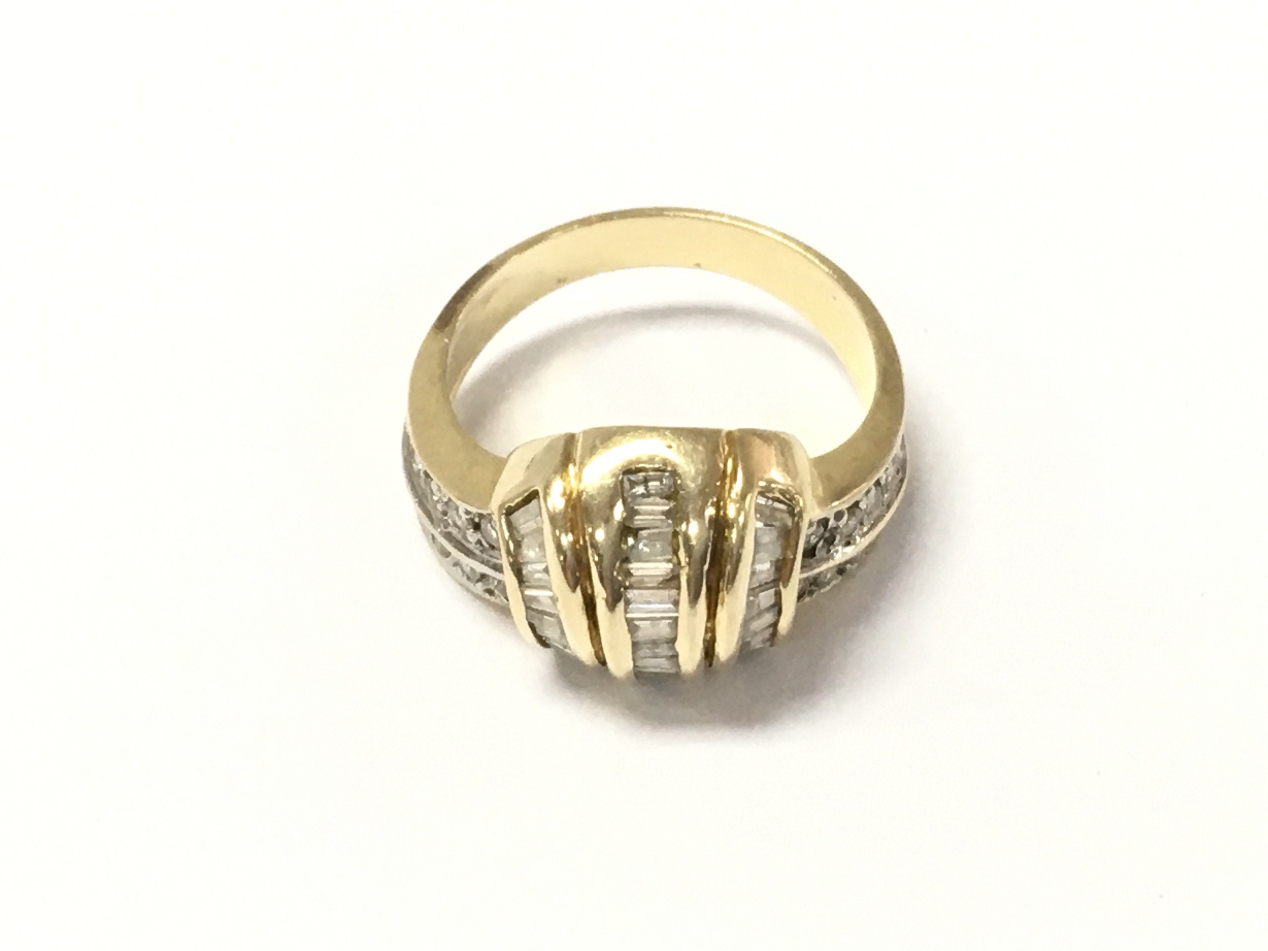 An unmarked gold diamond cluster ring. Size M and 3.5g