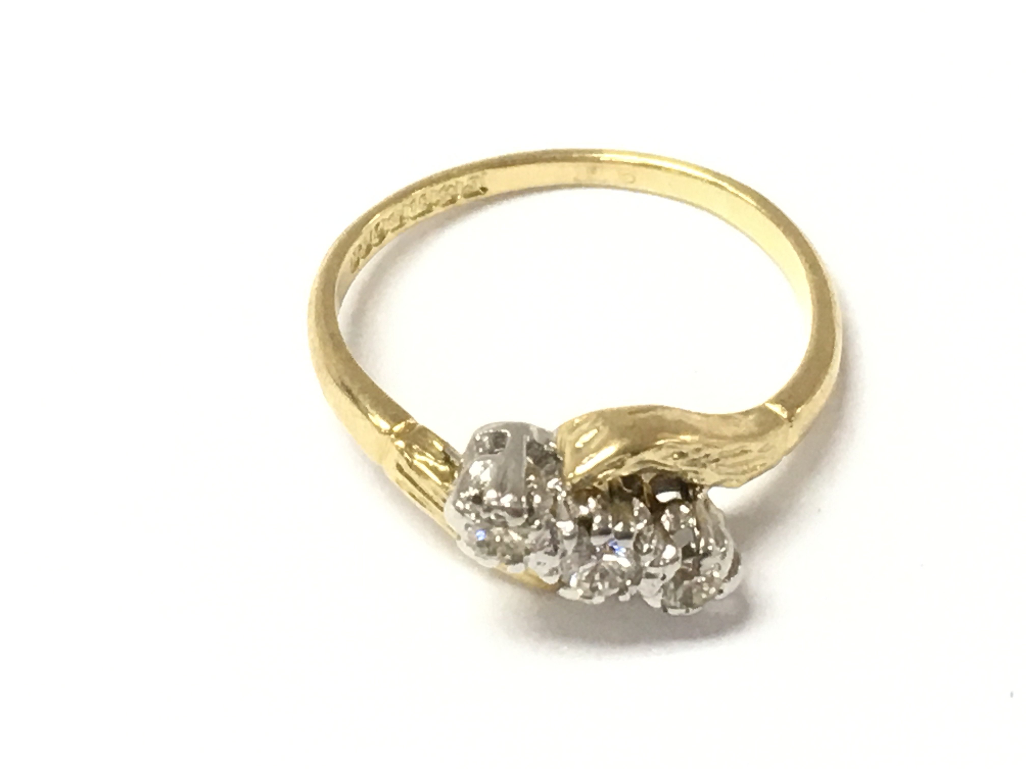 An 18ct gold 3 stone diamond ring. Size J and 2.8g