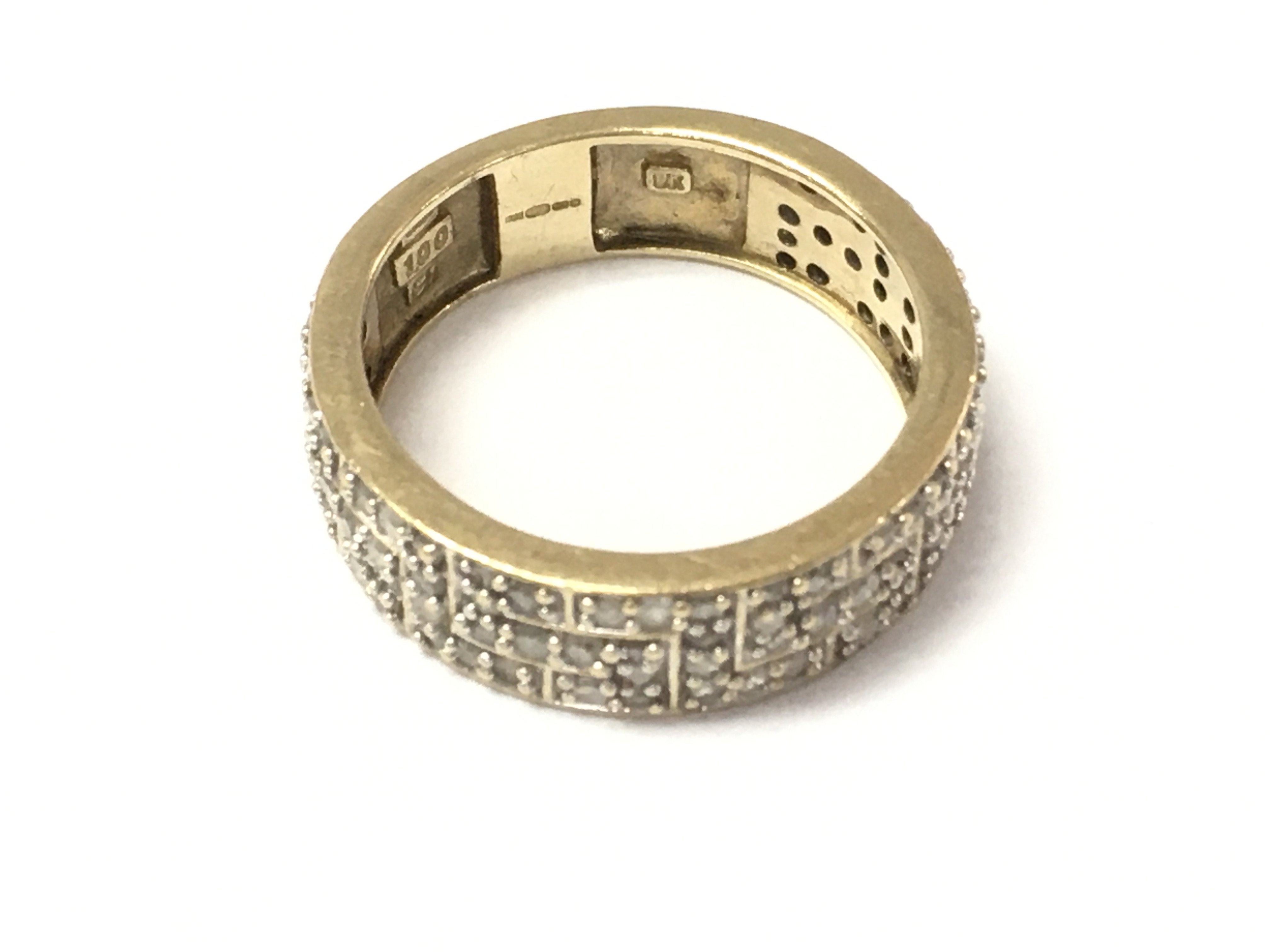 A 9ct diamond band ring 1ct. Size T and 6.35g