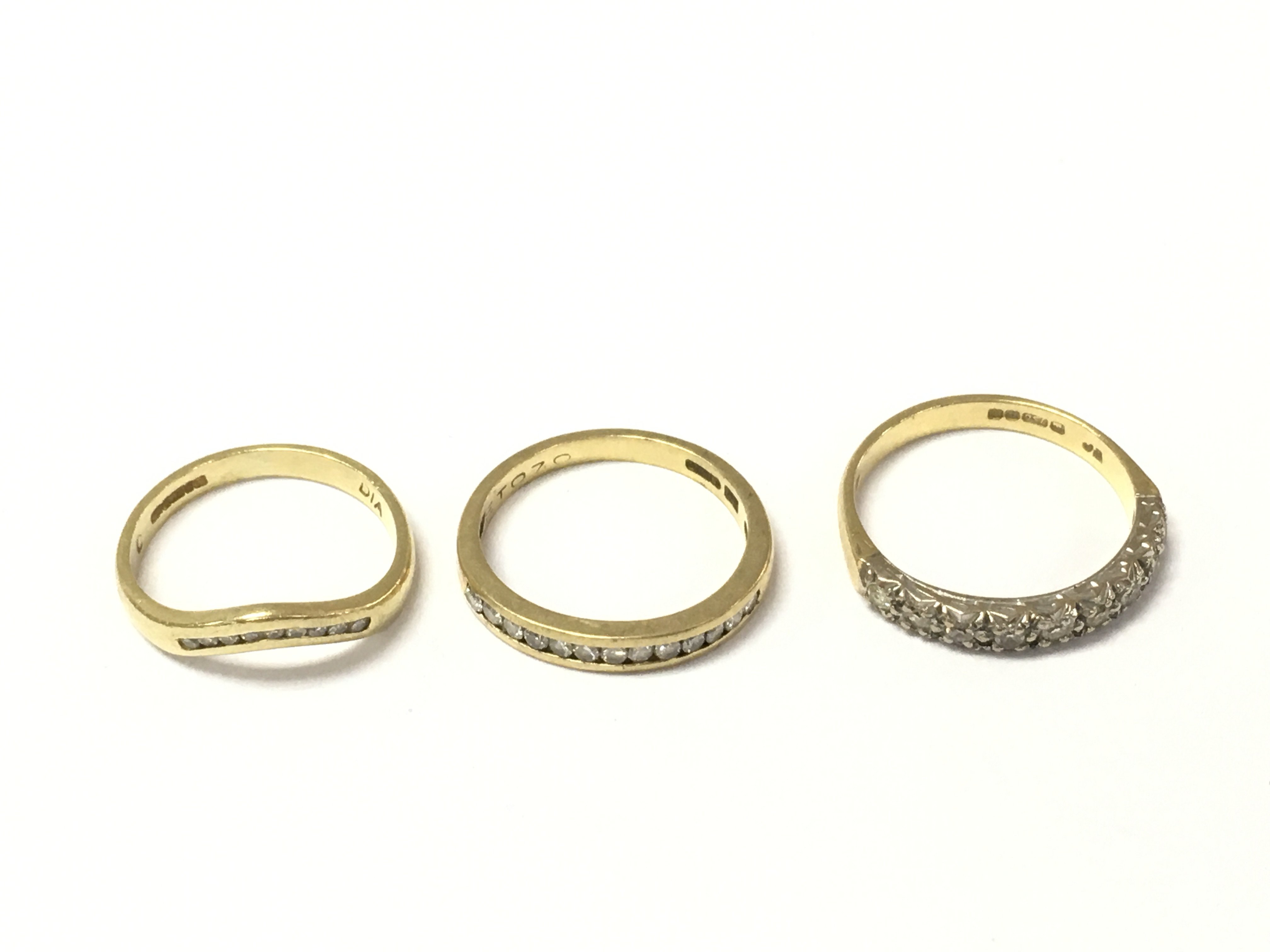 Three 18ct gold diamond 1/2 hoop rings. 7.35g