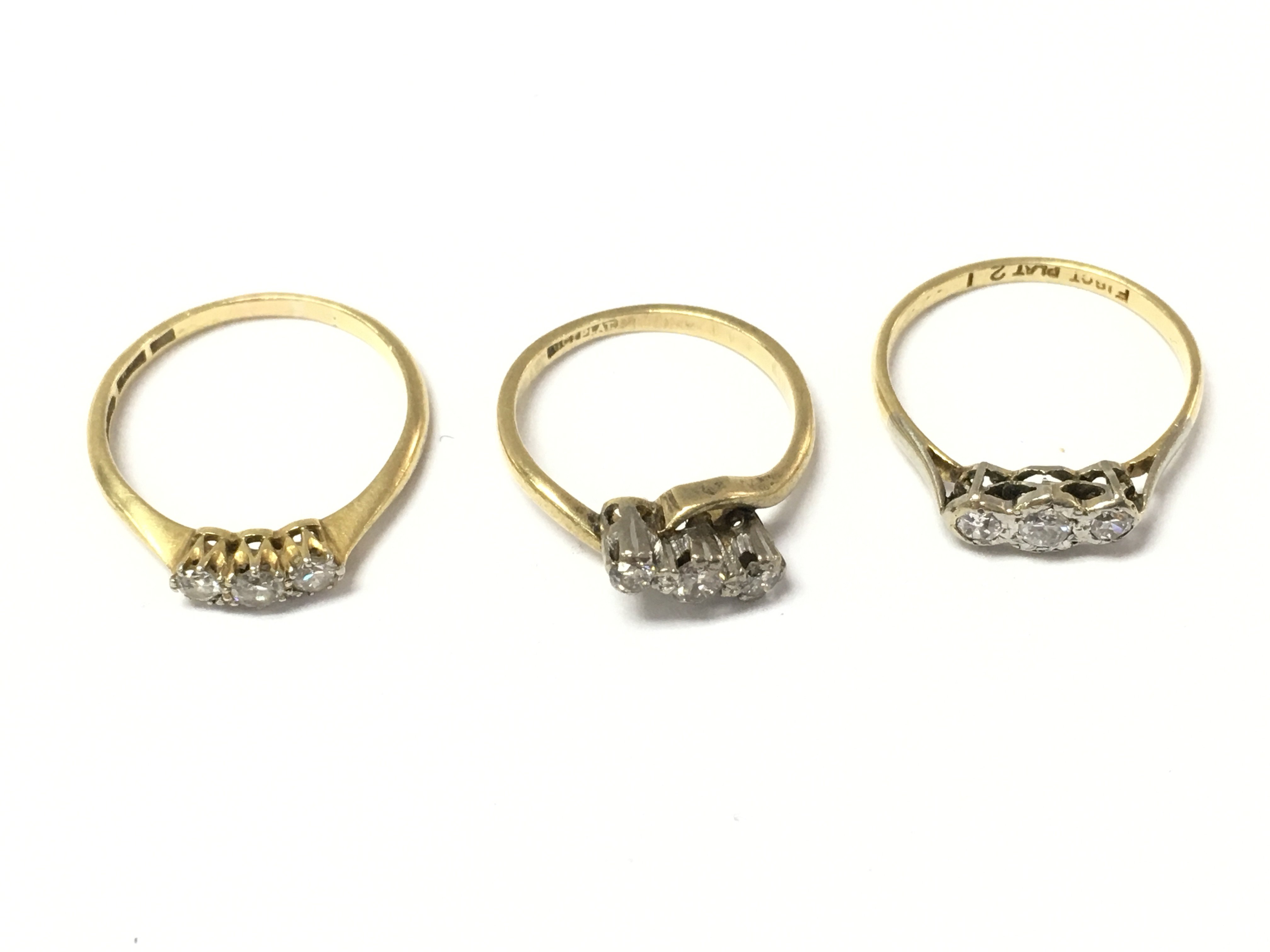 Three 18ct 3 stone diamond rings. 6.10g