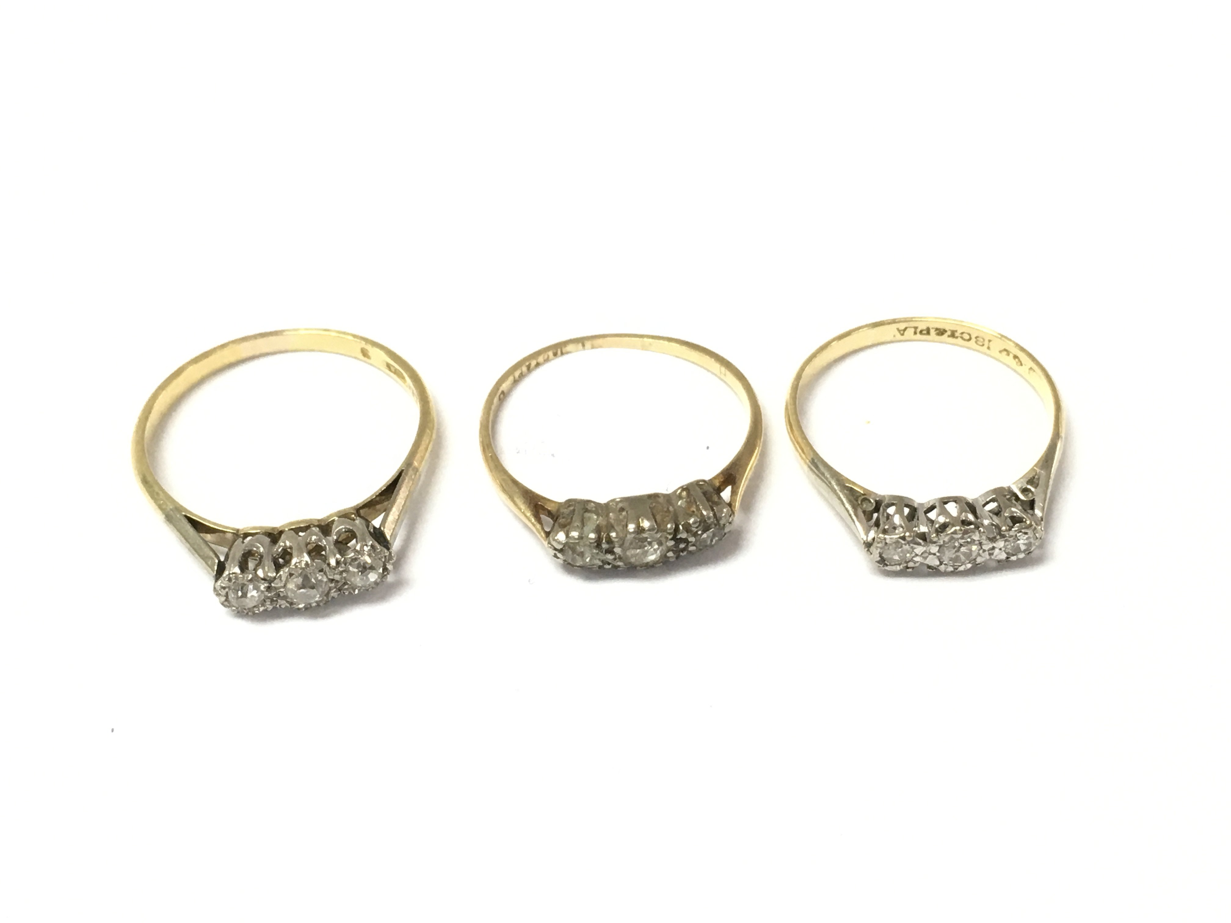 Three 18ct 3 stone diamond rings. 6.20g