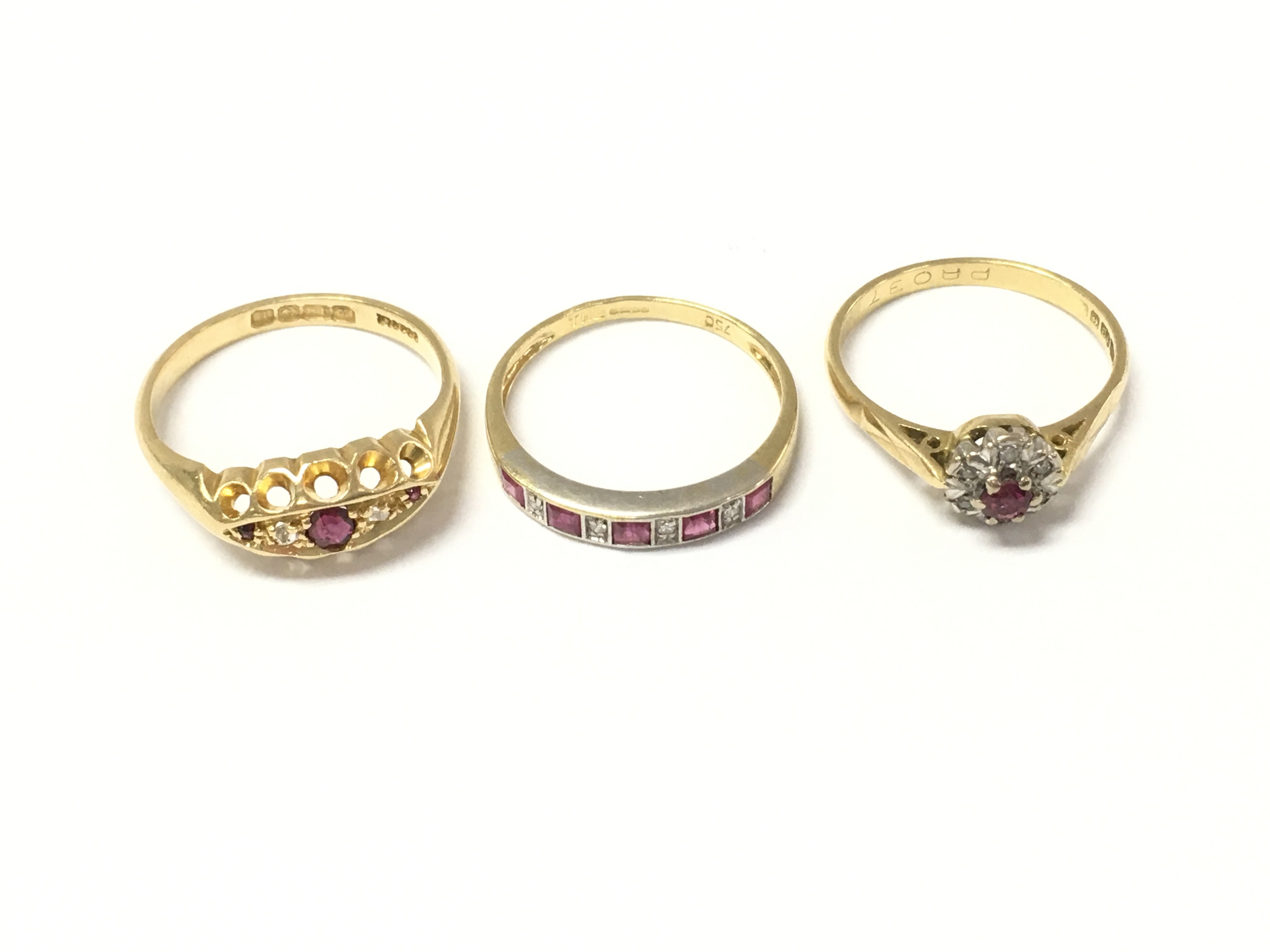 Three 18ct gold ruby and diamond rings. 8.33g