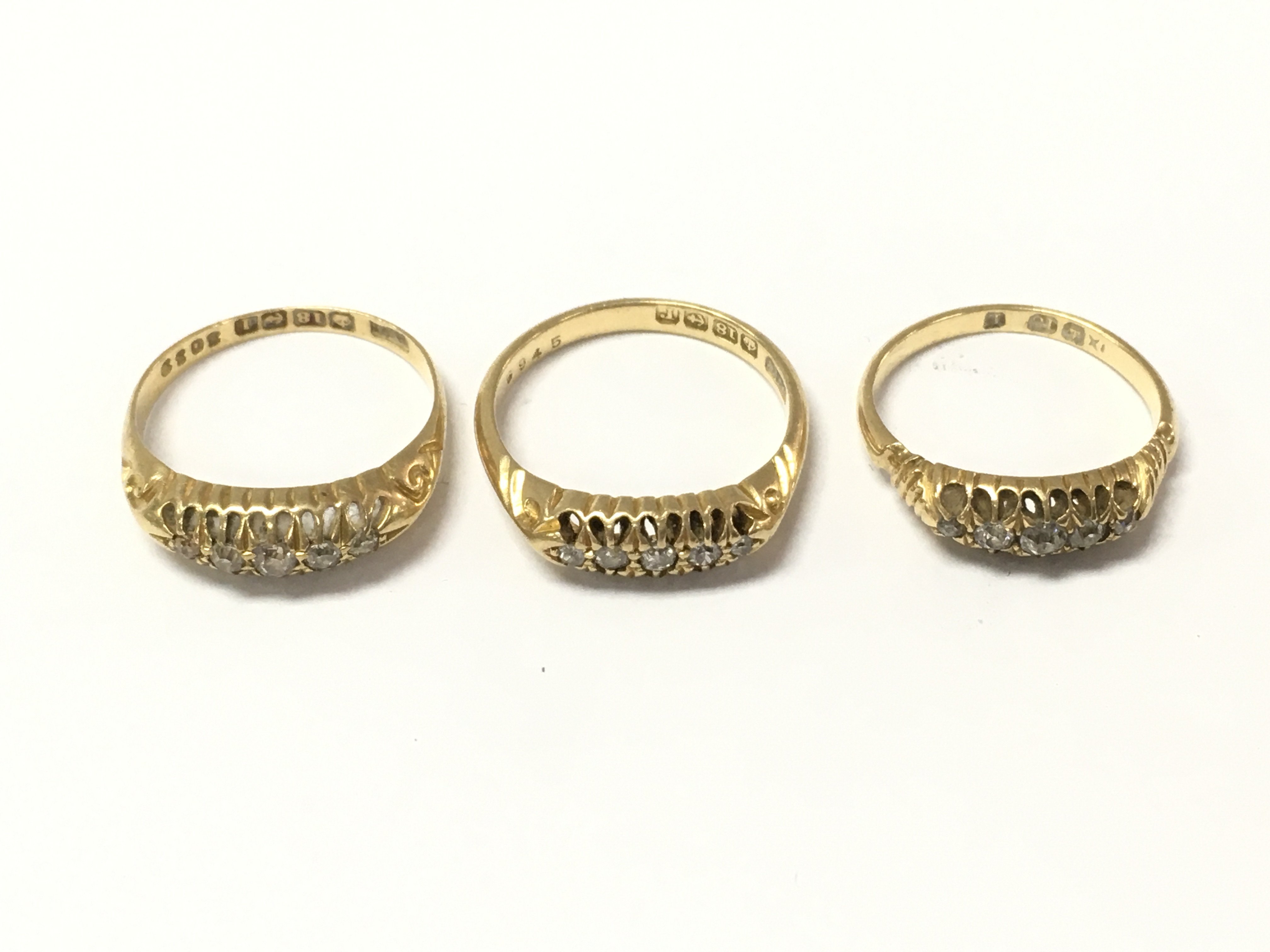 Three 18ct gold 5 stone diamond rings. 8.56g