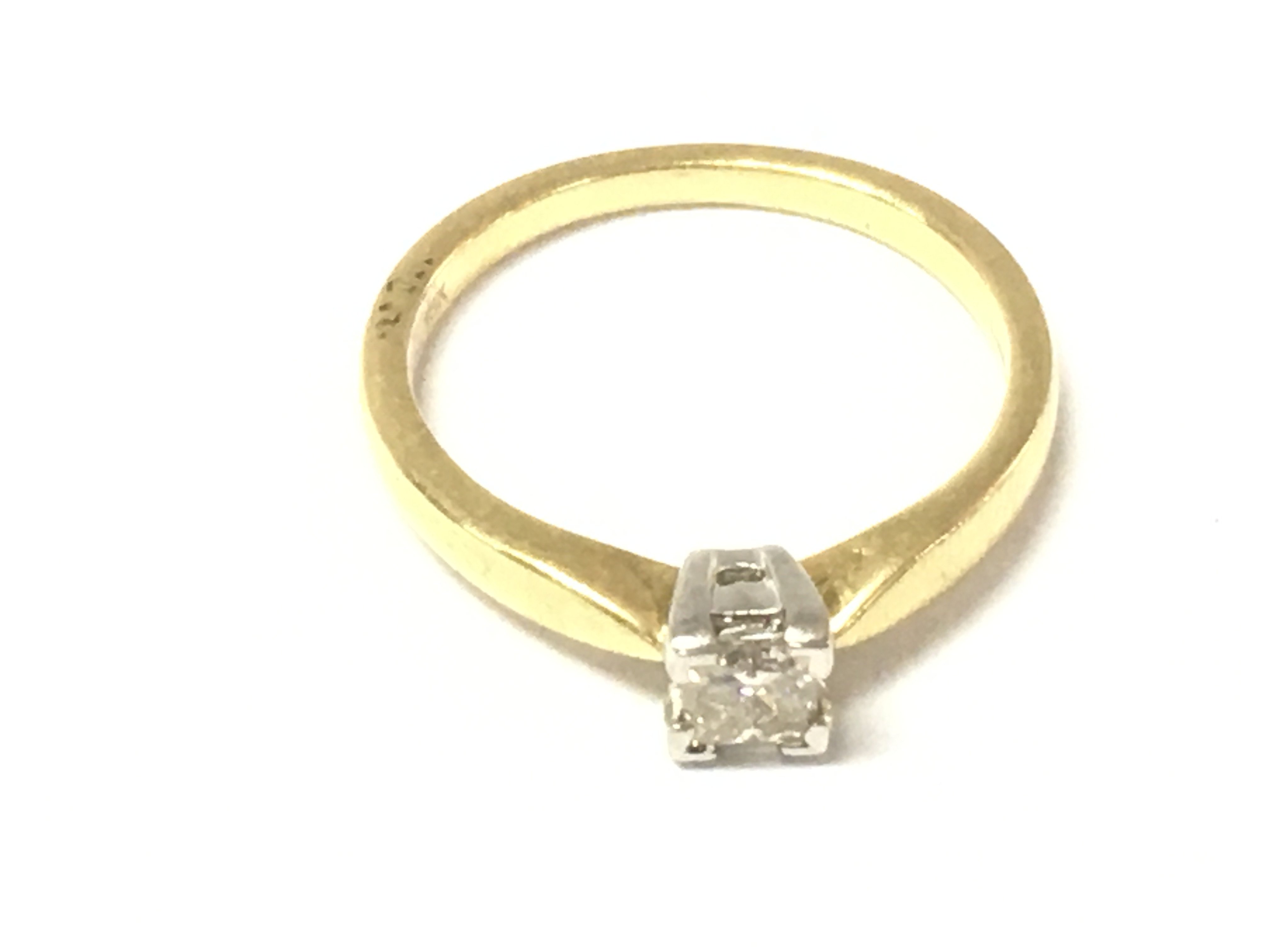 An 18ct gold princess cut diamond solitaire ring. Size M 1/2 and 3.52g