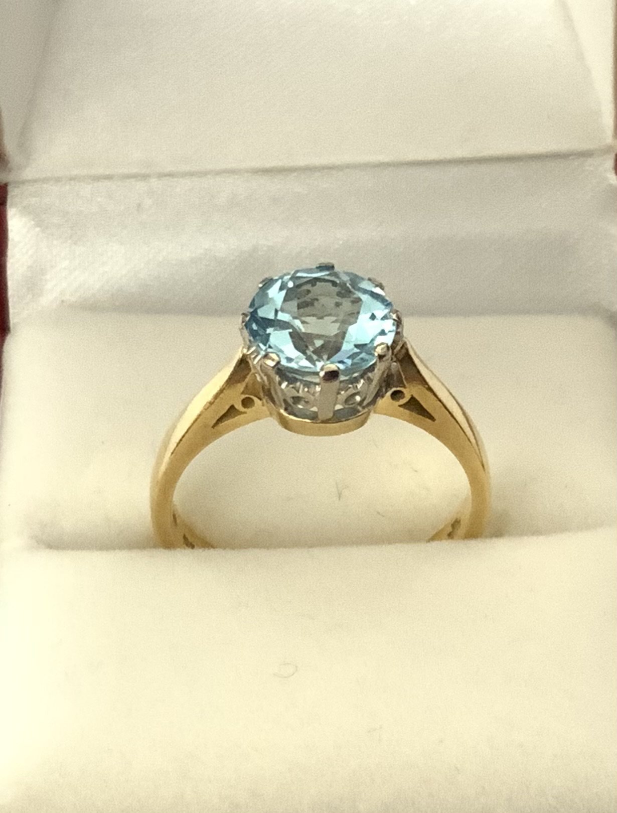 A large 18ct yellow gold Fancy blue topaz ring, Size N. (A)