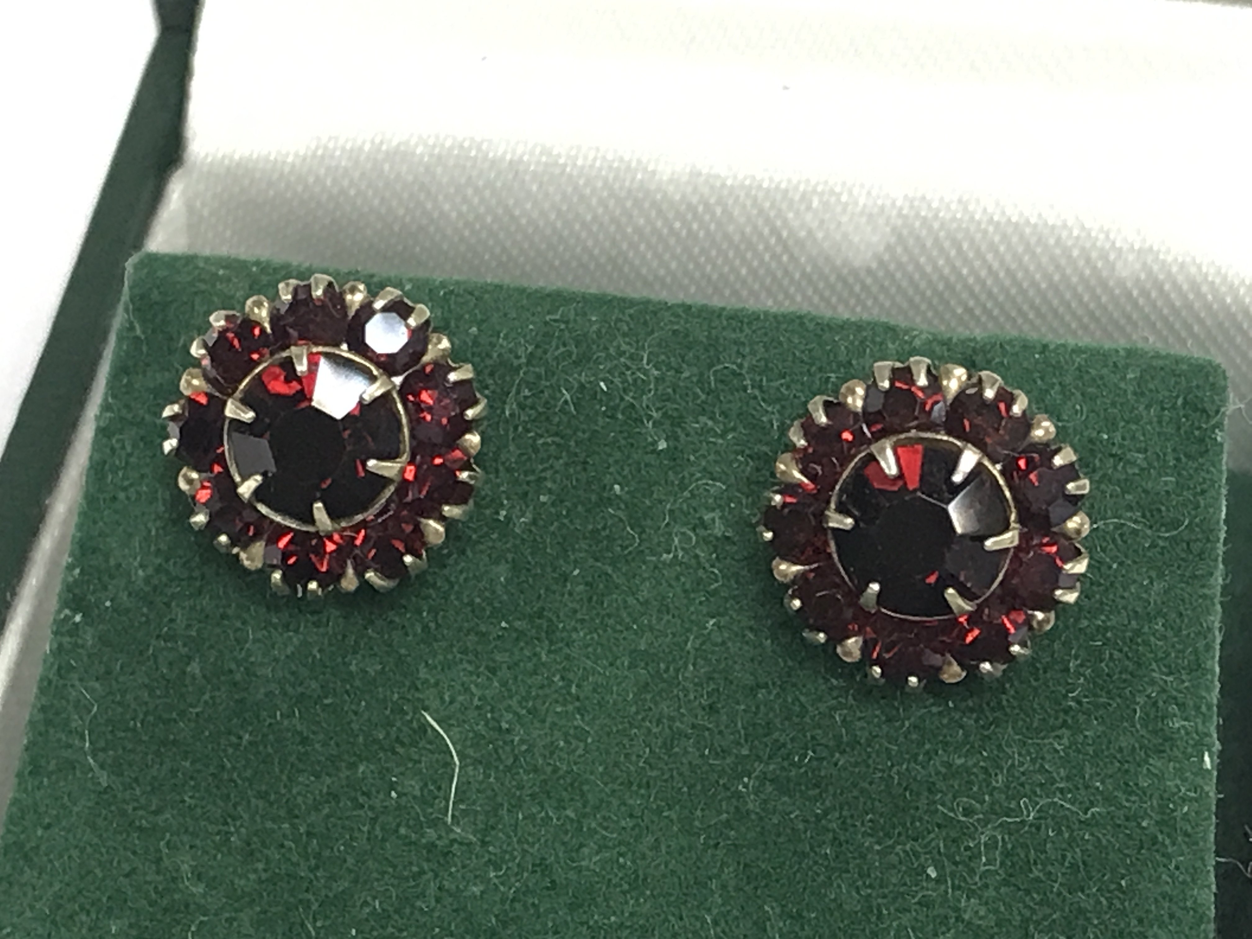 A pair of 9ct gold garnet earrings , 2g total weight. postage cat A