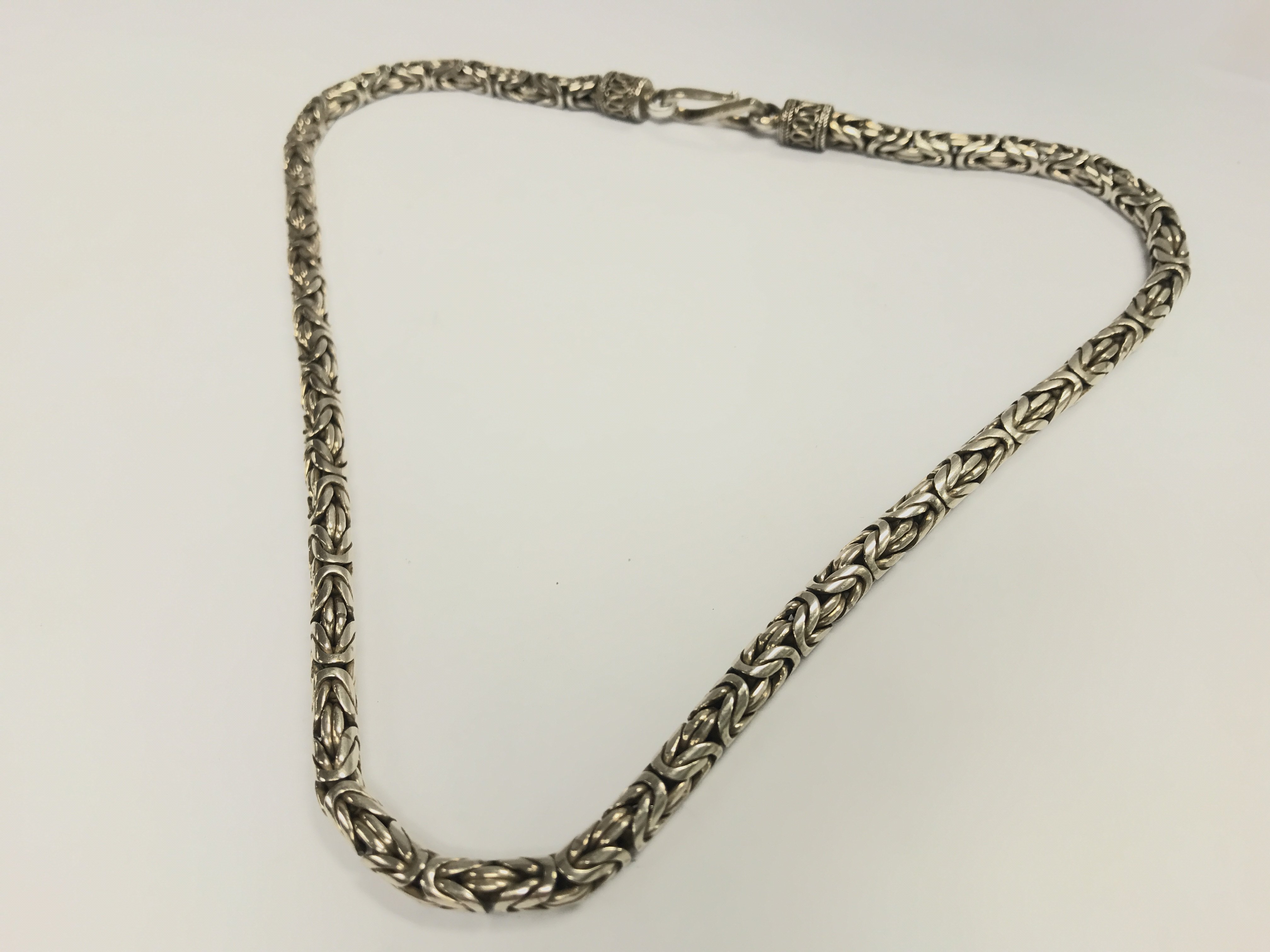 A heavy silver chain , 67g. Postage category A