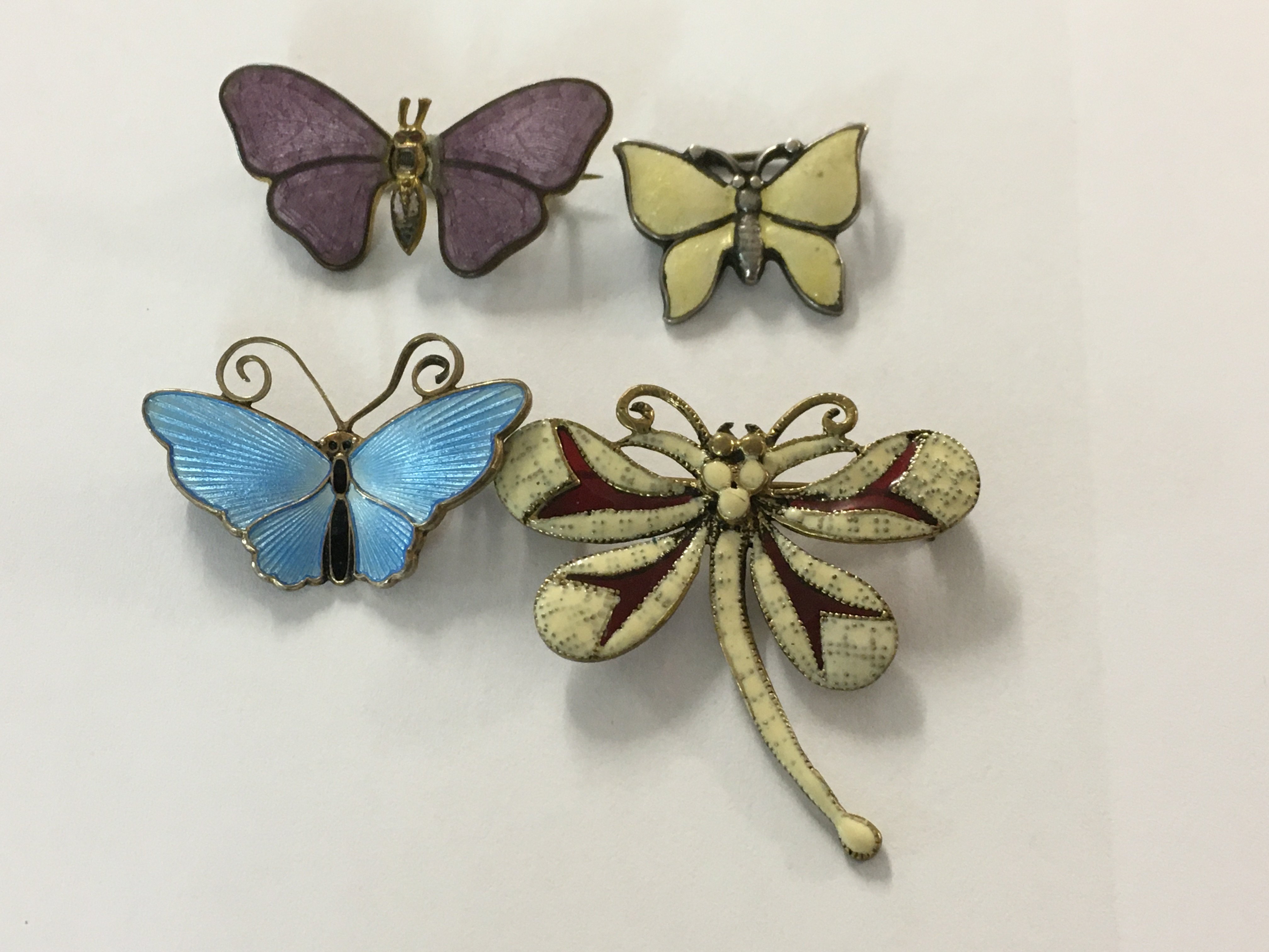 A Collection for enamel and dragonfly brooches.
