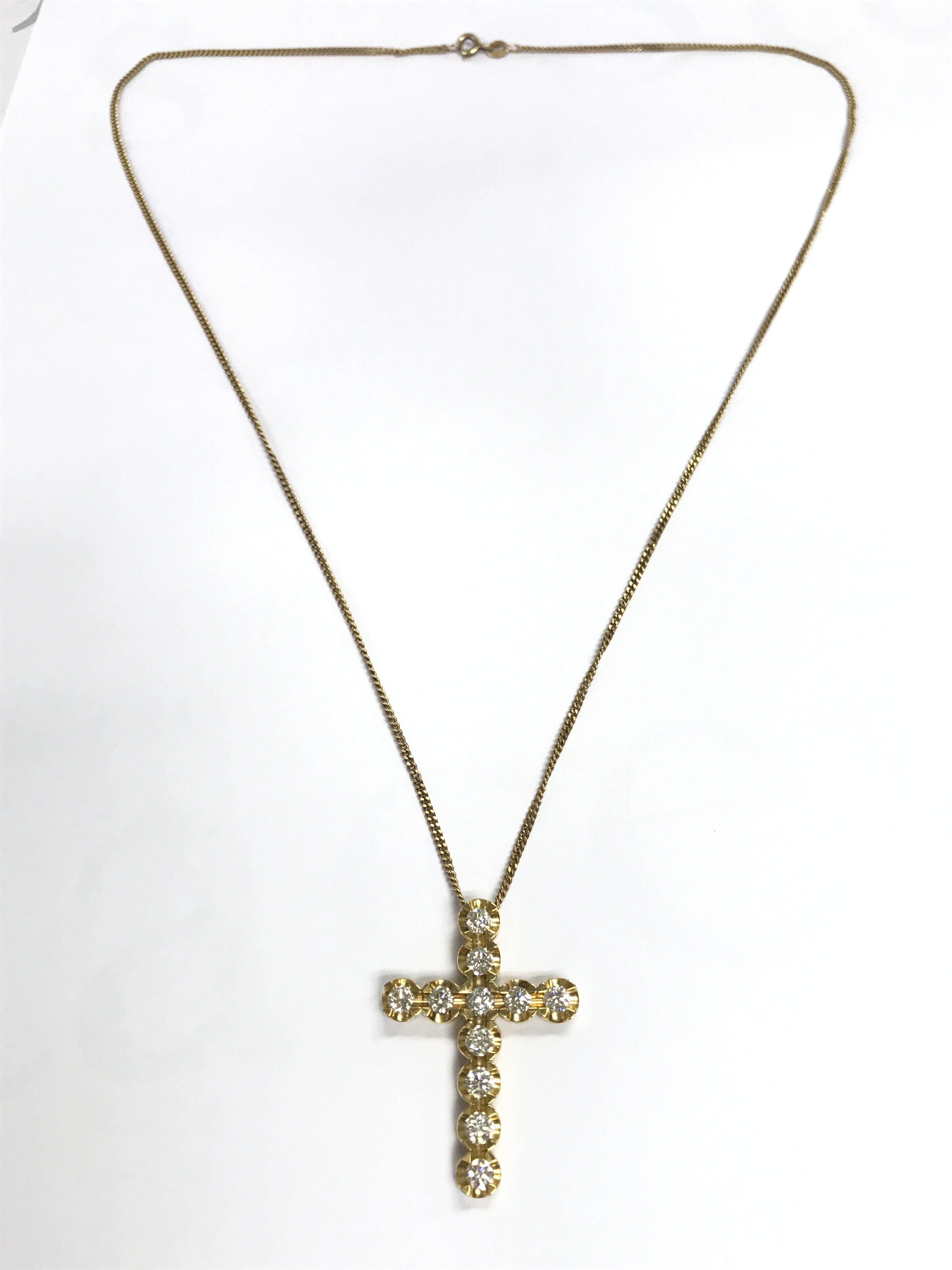 A 9ct gold diamond cross on chain , 10g total weight. Postage category A