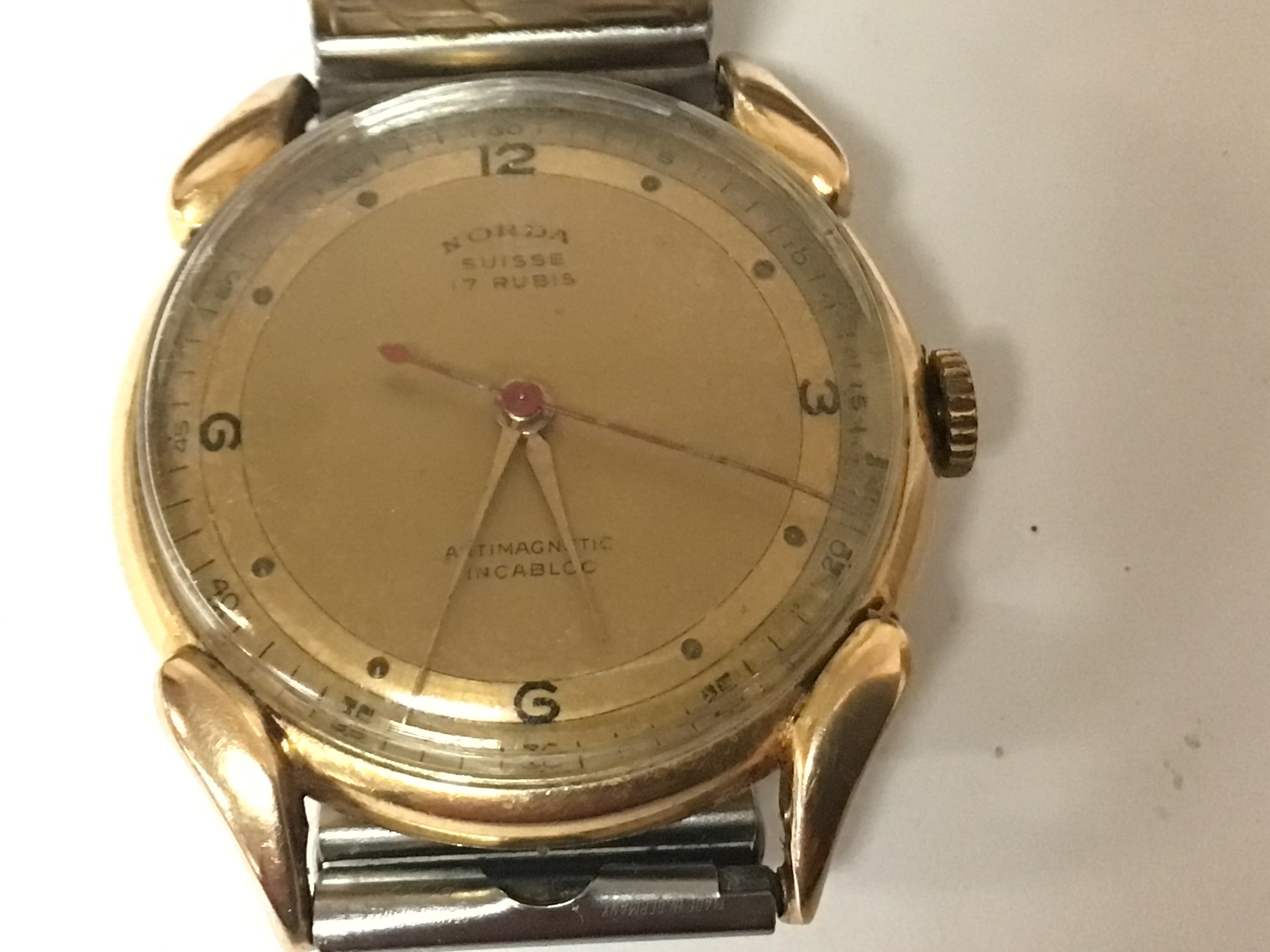 A rare Vintage Swiss 18carat gold cased Norda 17 Jewel manual wind gents wrist watch serial number 2534 seen working with a later replacement strap.