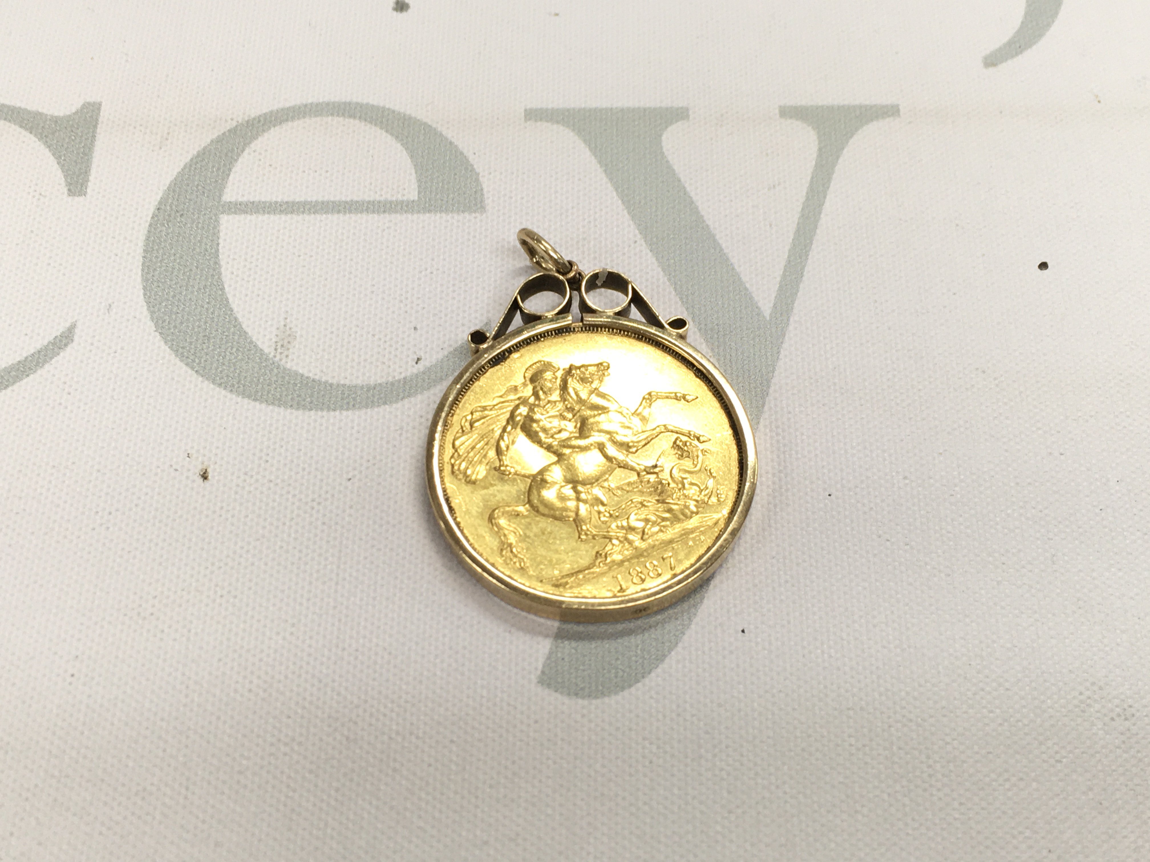 An 1887 double sovereign vvf in a 9ct gold pendant mount.