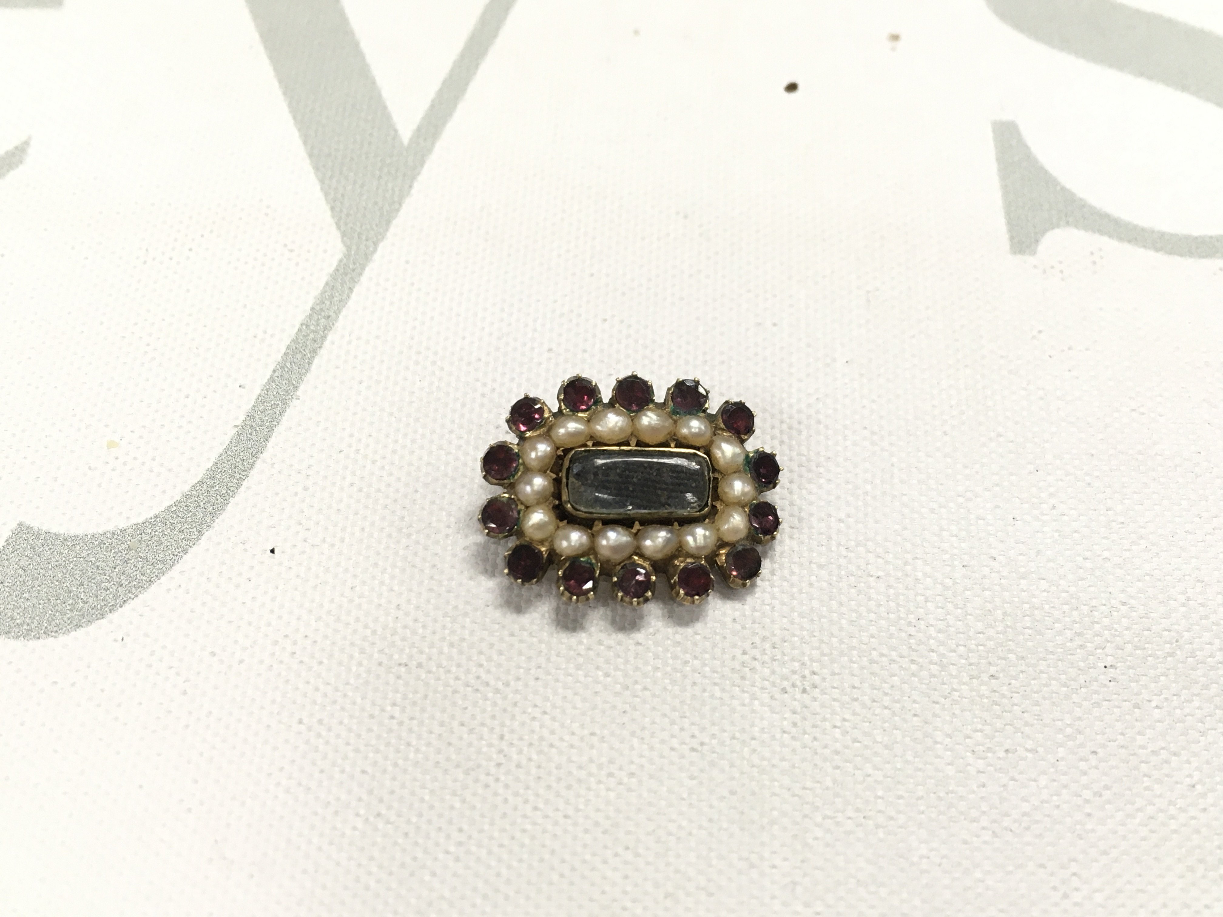 A small victorian mourning brooch.