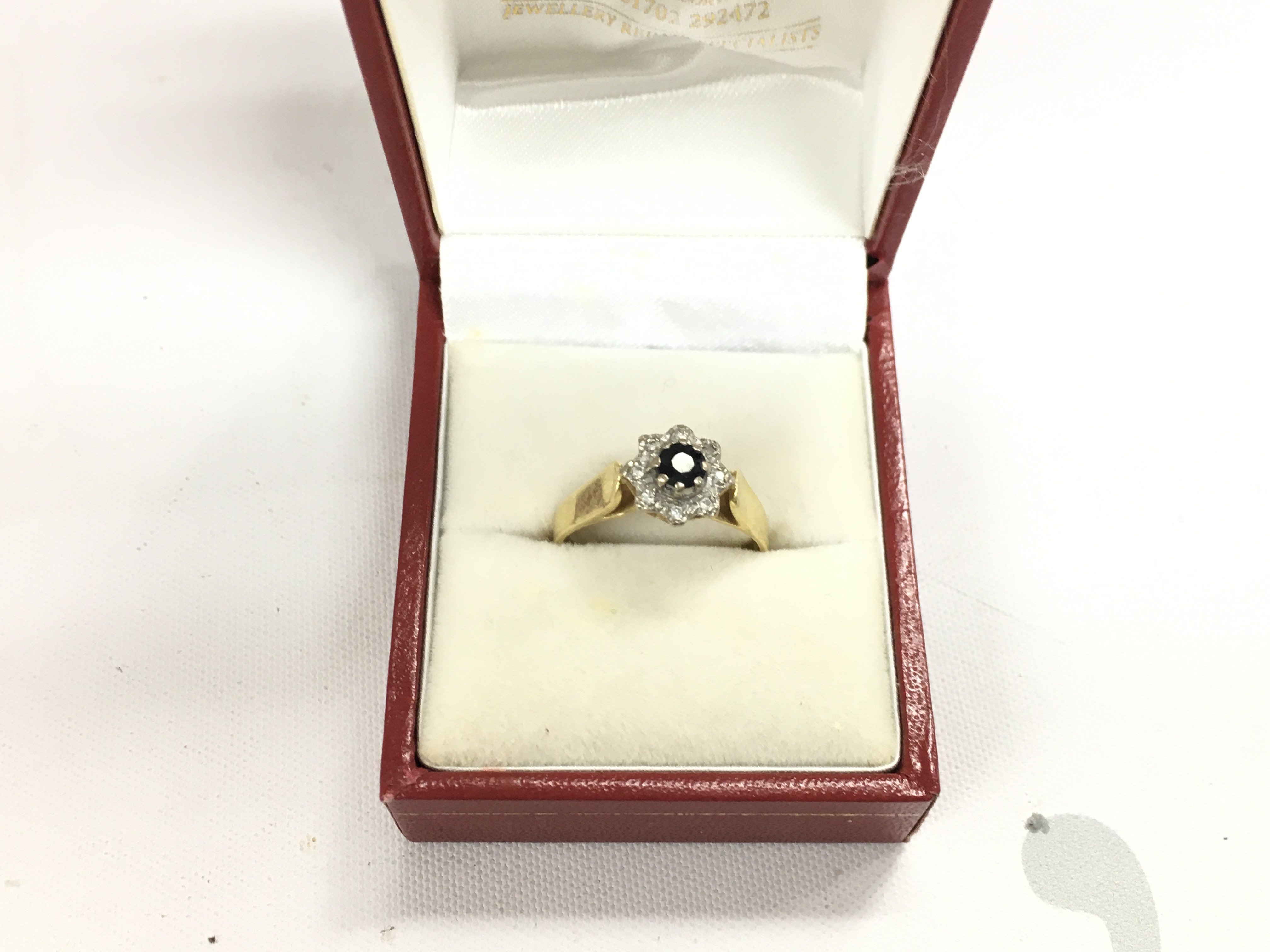 An 18ct fold sapphire and diamond set ring. Approx weight 3.62 grams, size P.