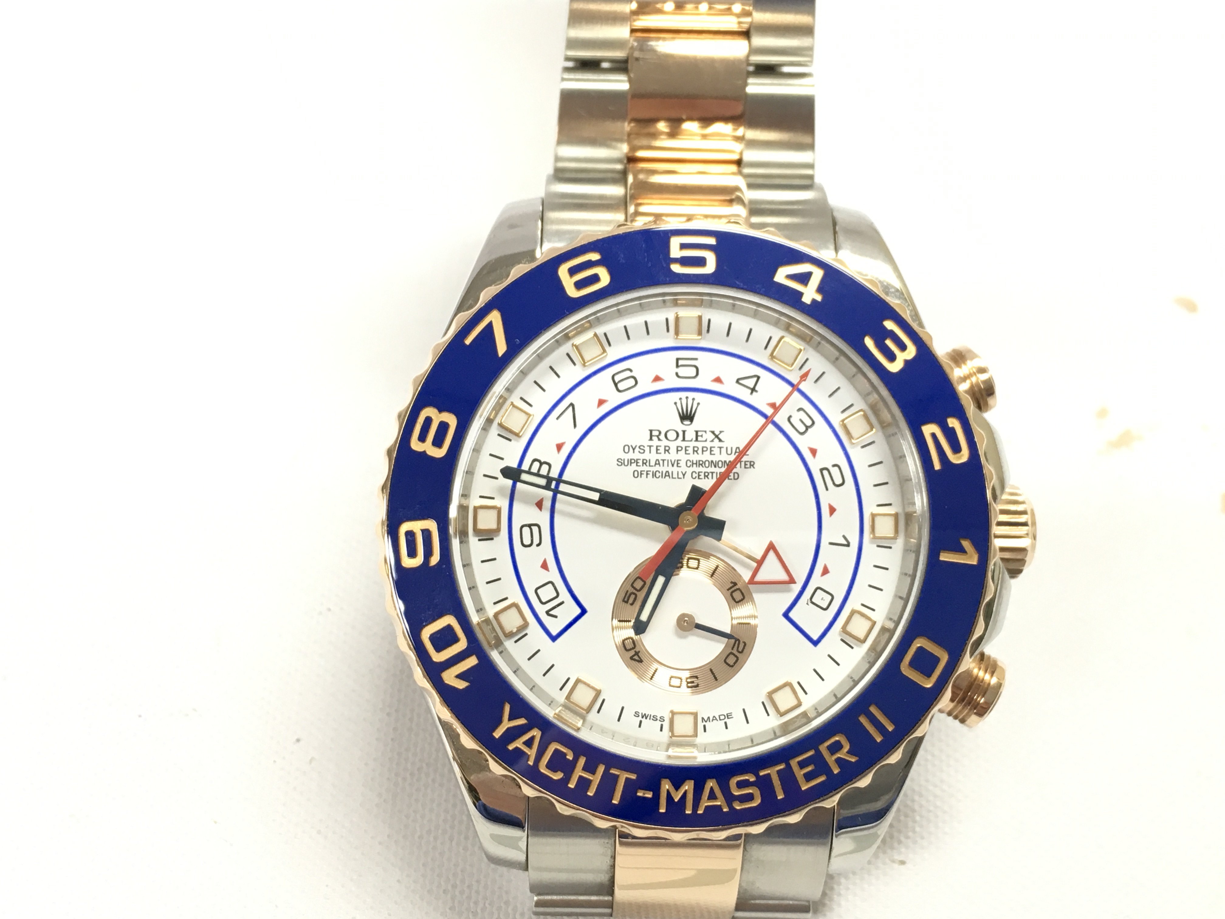A Rolex yacht master II 2015 comes with box papers and swing tags. 44mm case with steel and gold oyster bracelet. White dial. Seen running. Model 116681.