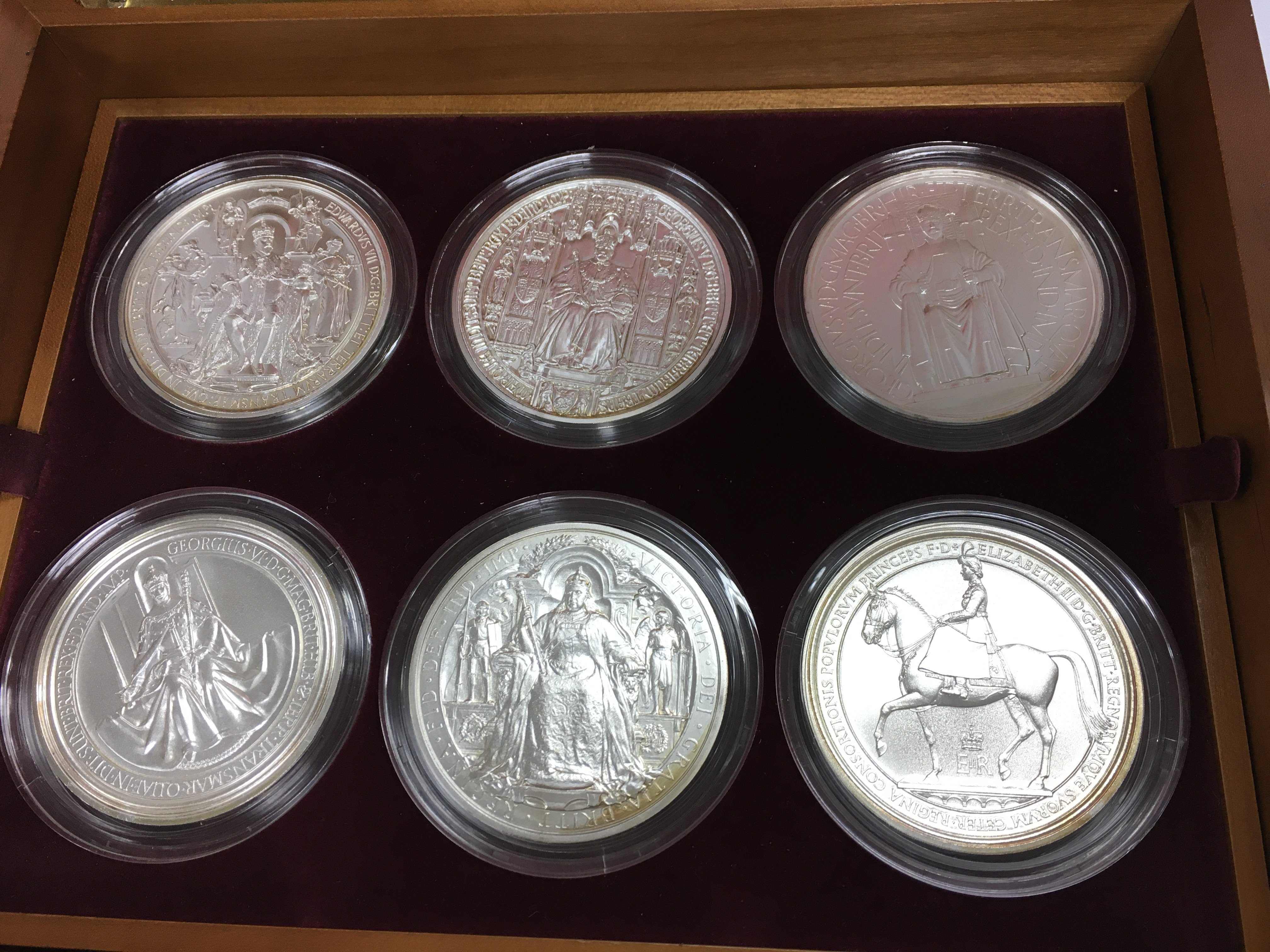 A collection of six 5oz fine silver satin finish coins featuring great seals of the realms. Postage B