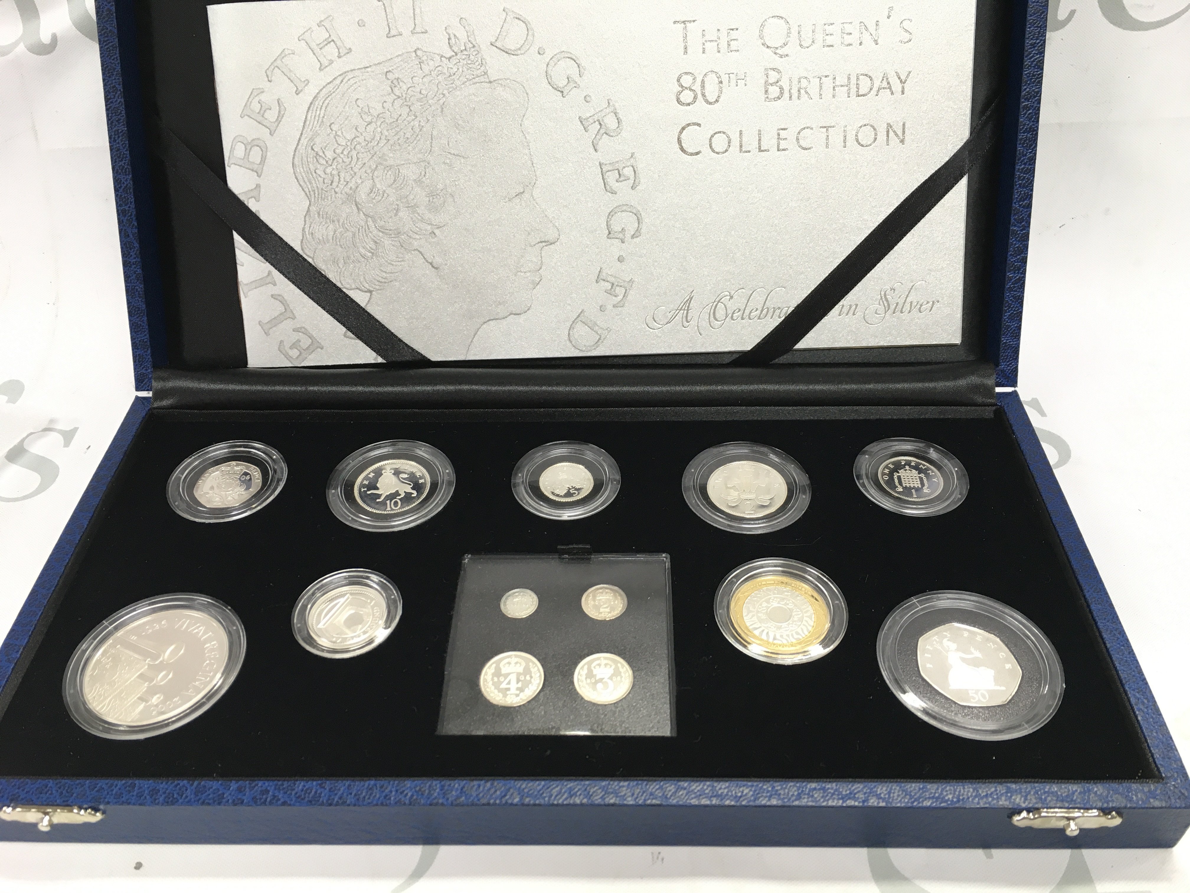 The queens 80th birthday coin collection in silver from the royal mint. Postage B
