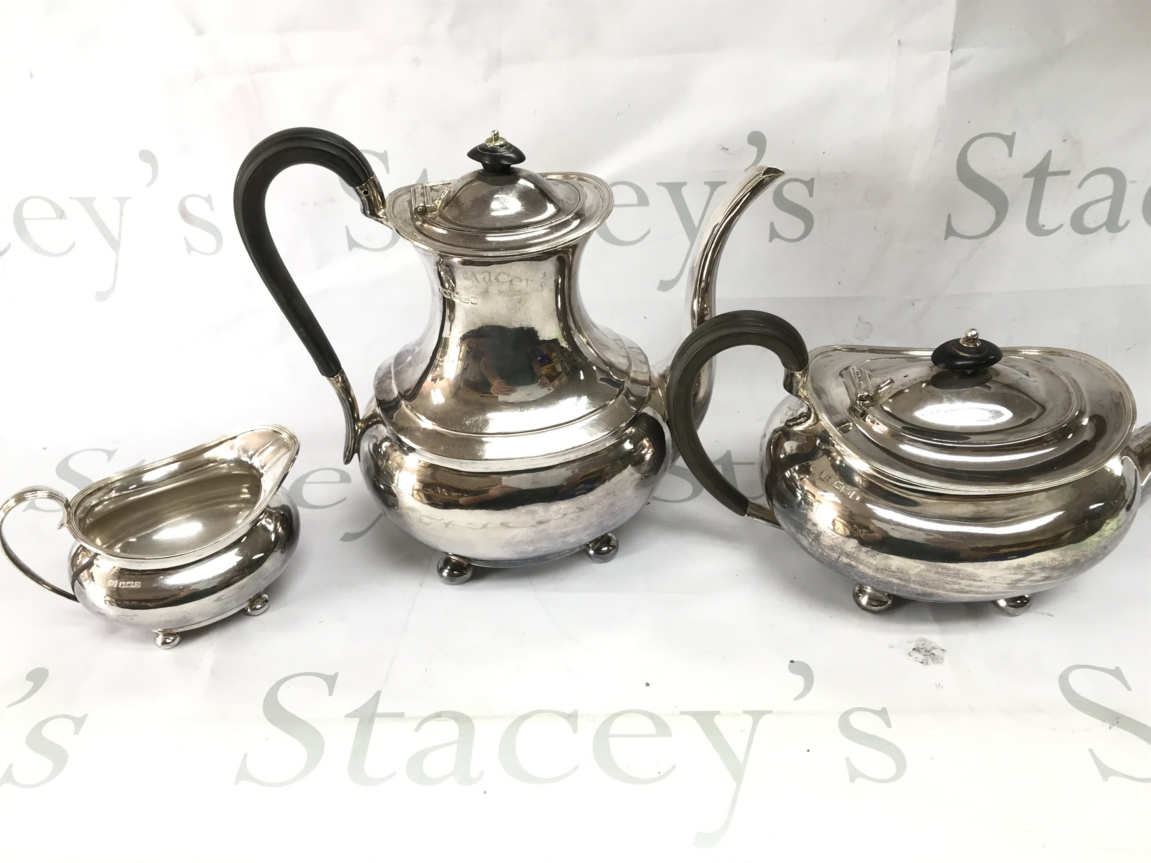 A three piece silver Sheffield hallmarked tea set. 1440g