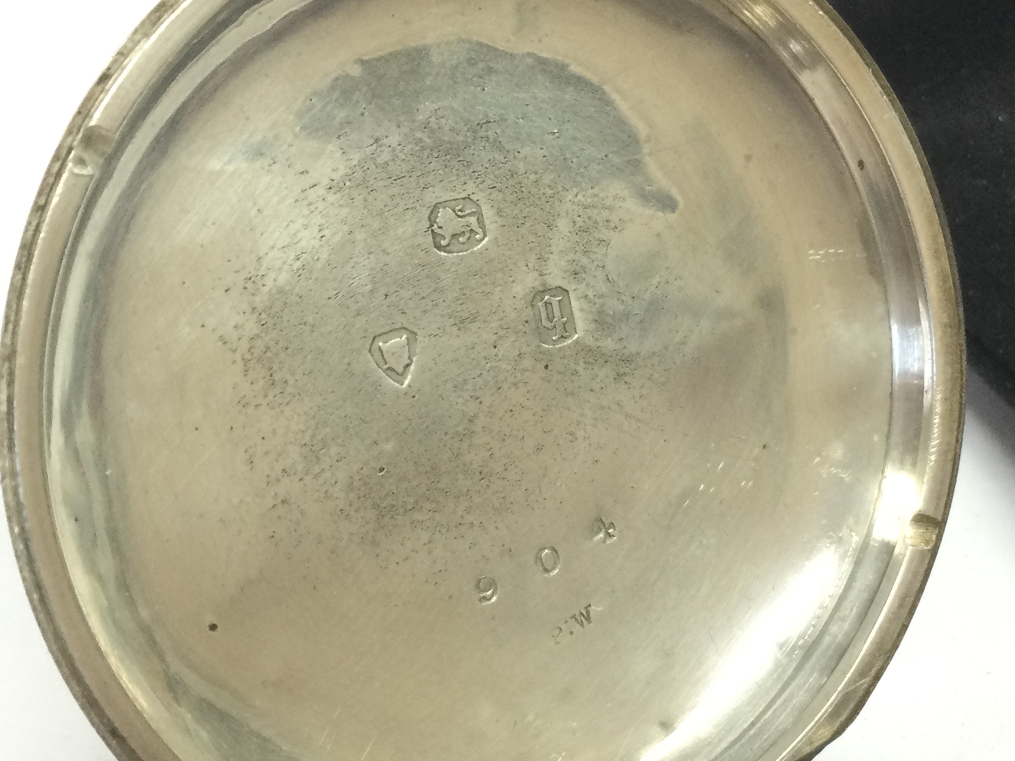 A 20th century silver hallmarked cased pocket watch with a subsidiary dial and key. Postage category A.