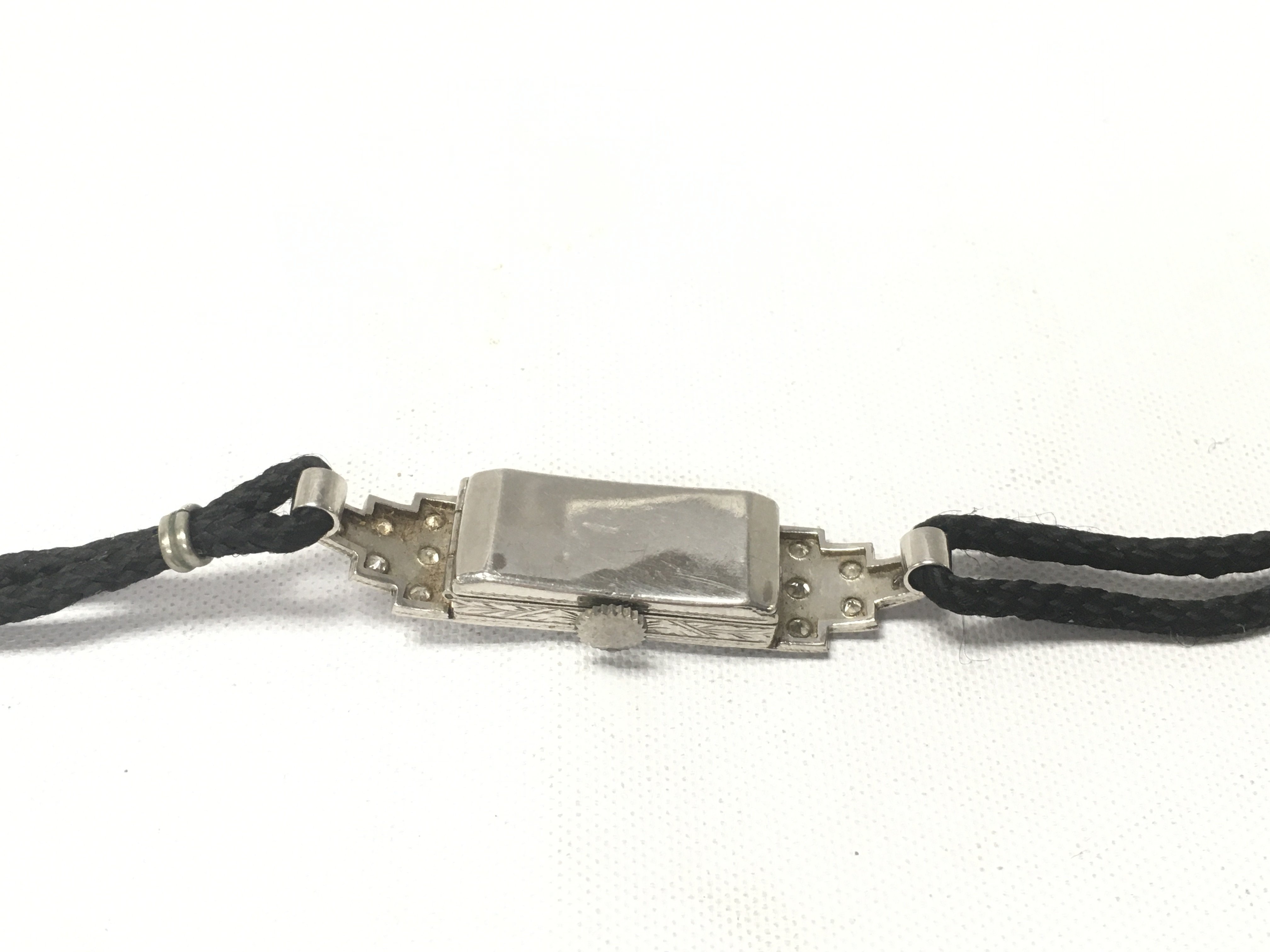 A 1930s platinum and diamond cocktail watch.